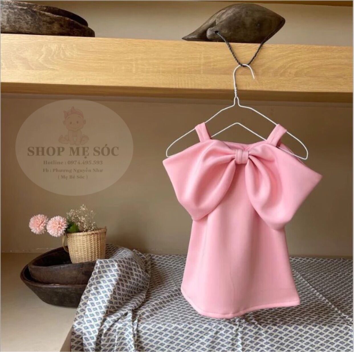 Váy hồng nơ bản to cho bé gái