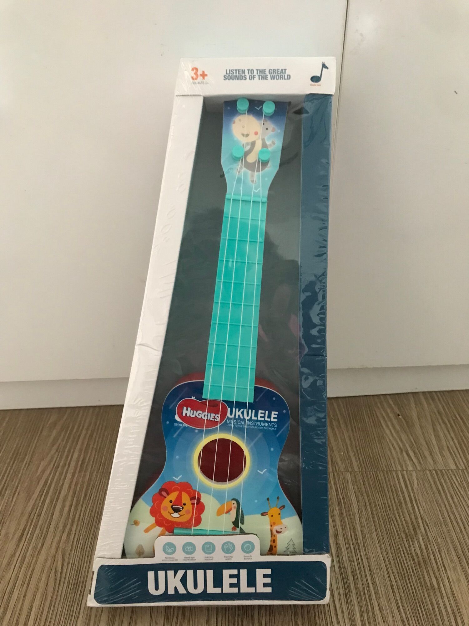 Đàn ukulele mini cho bé quà tặng huggies