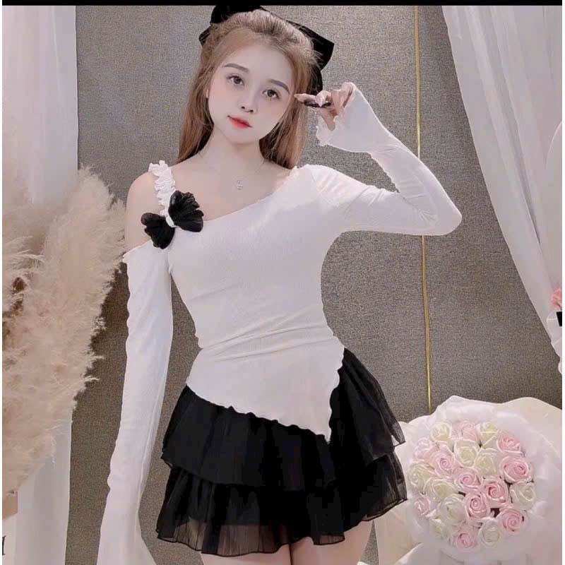 Áo lệch vai nơ vạt nhọn tay dài viền bèo