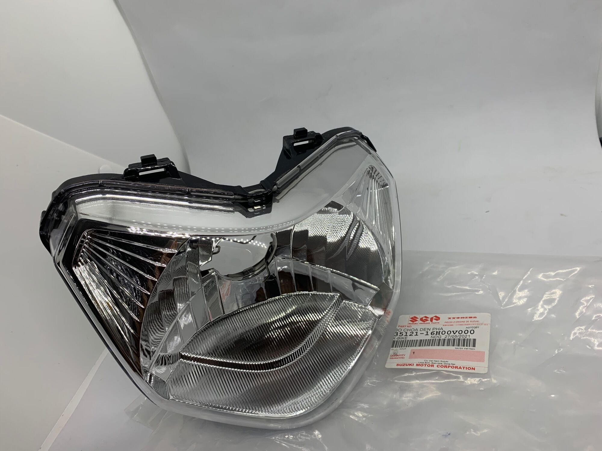 Pha đèn trước axelo 125 xbike suzuki