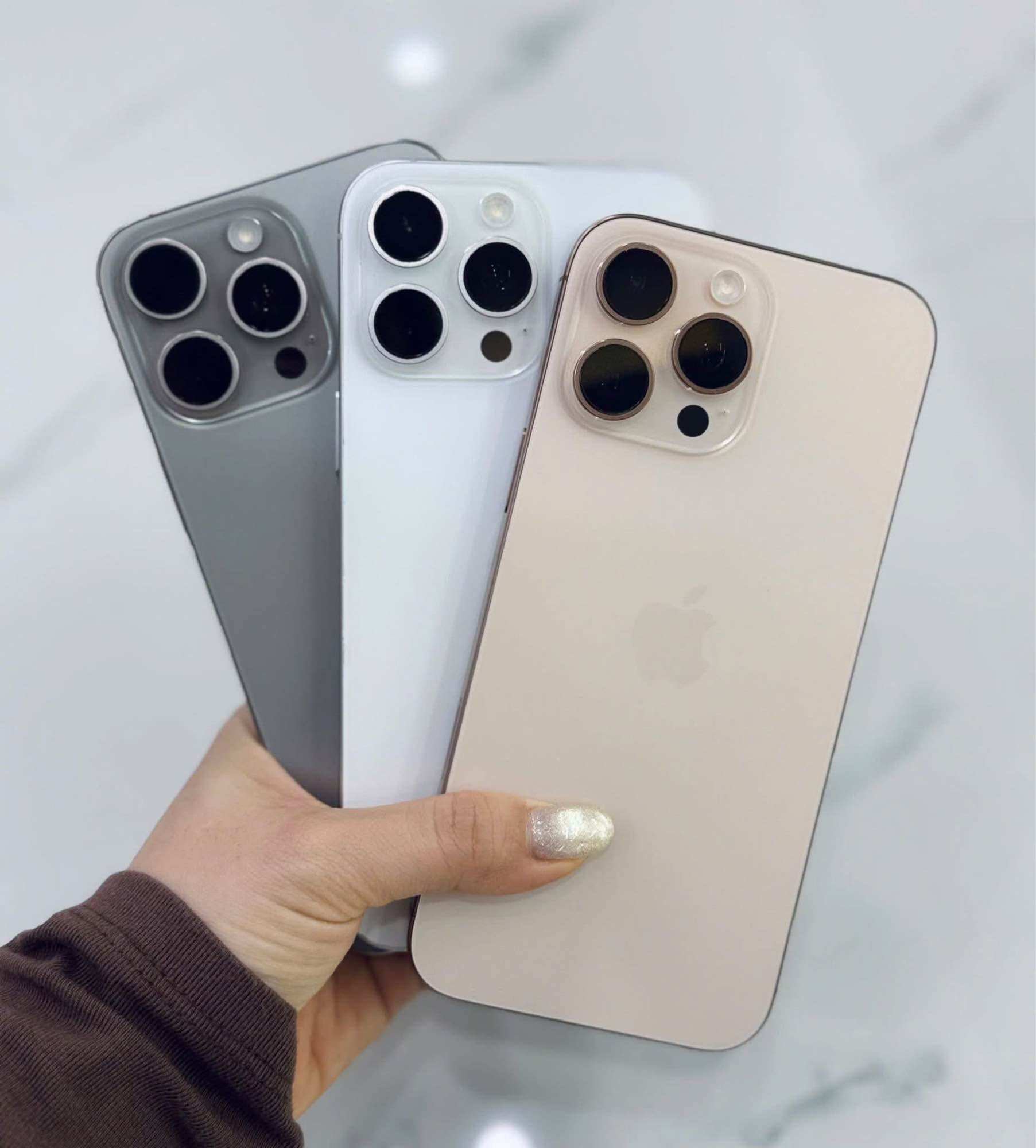 iPhone 15 Pro Max Phone Comes in Three Colors: Gray, White, Gold. Luxurious Design with Three Rear Cameras.