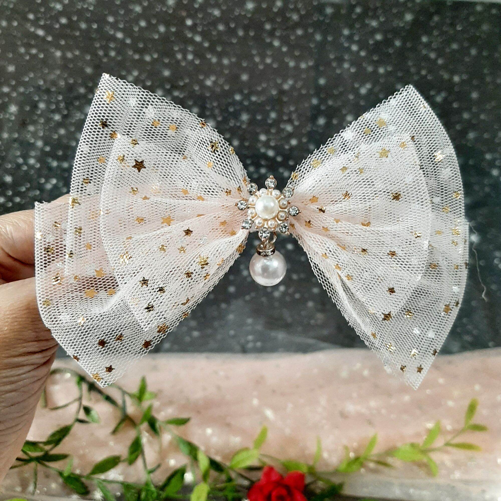 Kẹp tóc nơ đính sao lấp lánh đính ngọc