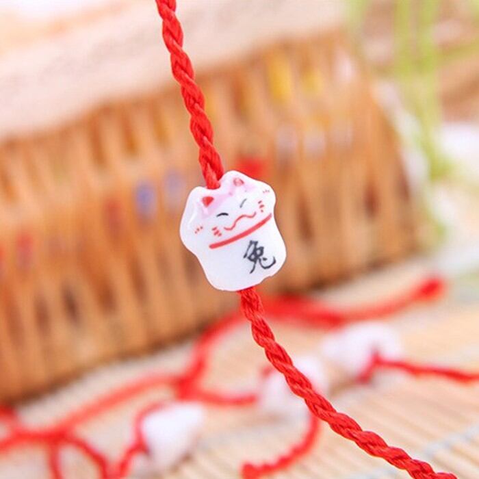 Vòng mèo thần tài gốm sứ chỉ đỏ may mắn