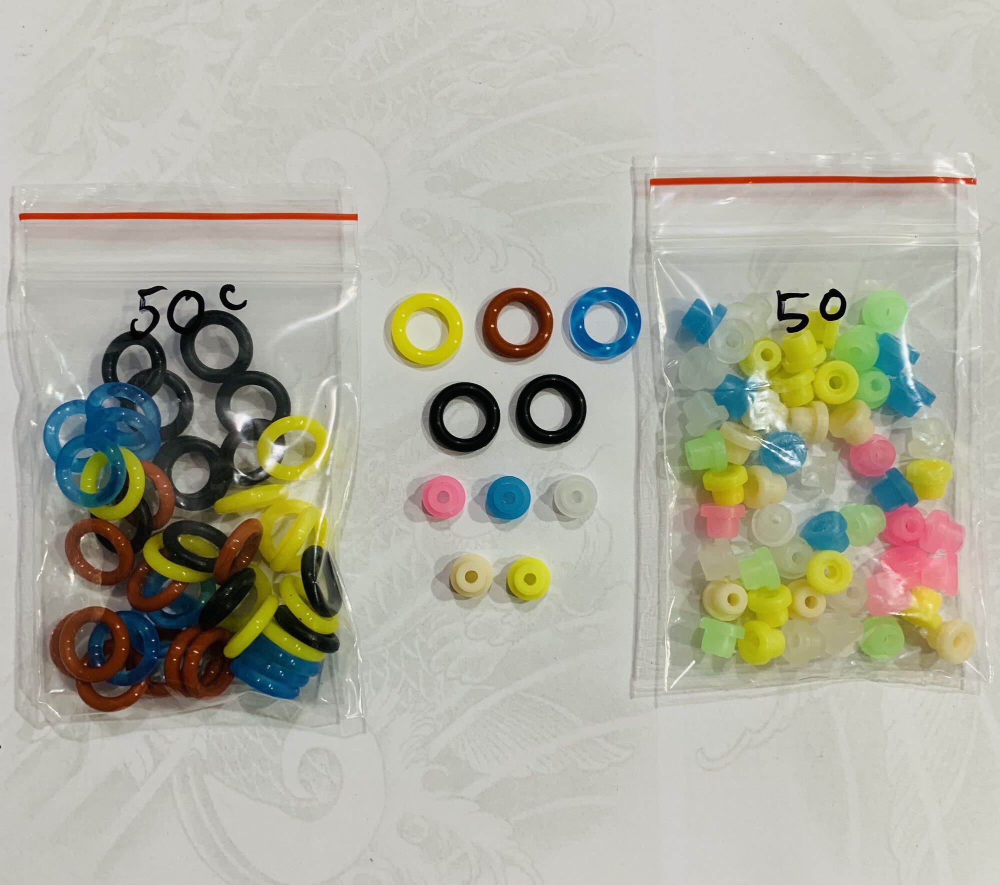50 vòng đàn hồi + 50 núm giữ kim của máy xăm