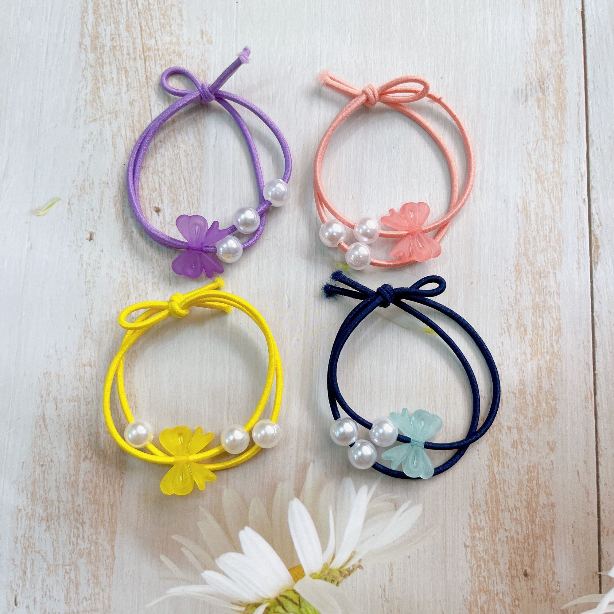 Set 100 dây cột tóc nơ ngọc 3 hạt trai giá rẻ