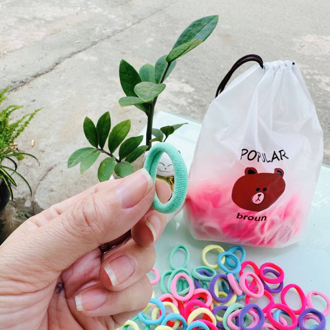 Túi 100 dây cột tóc