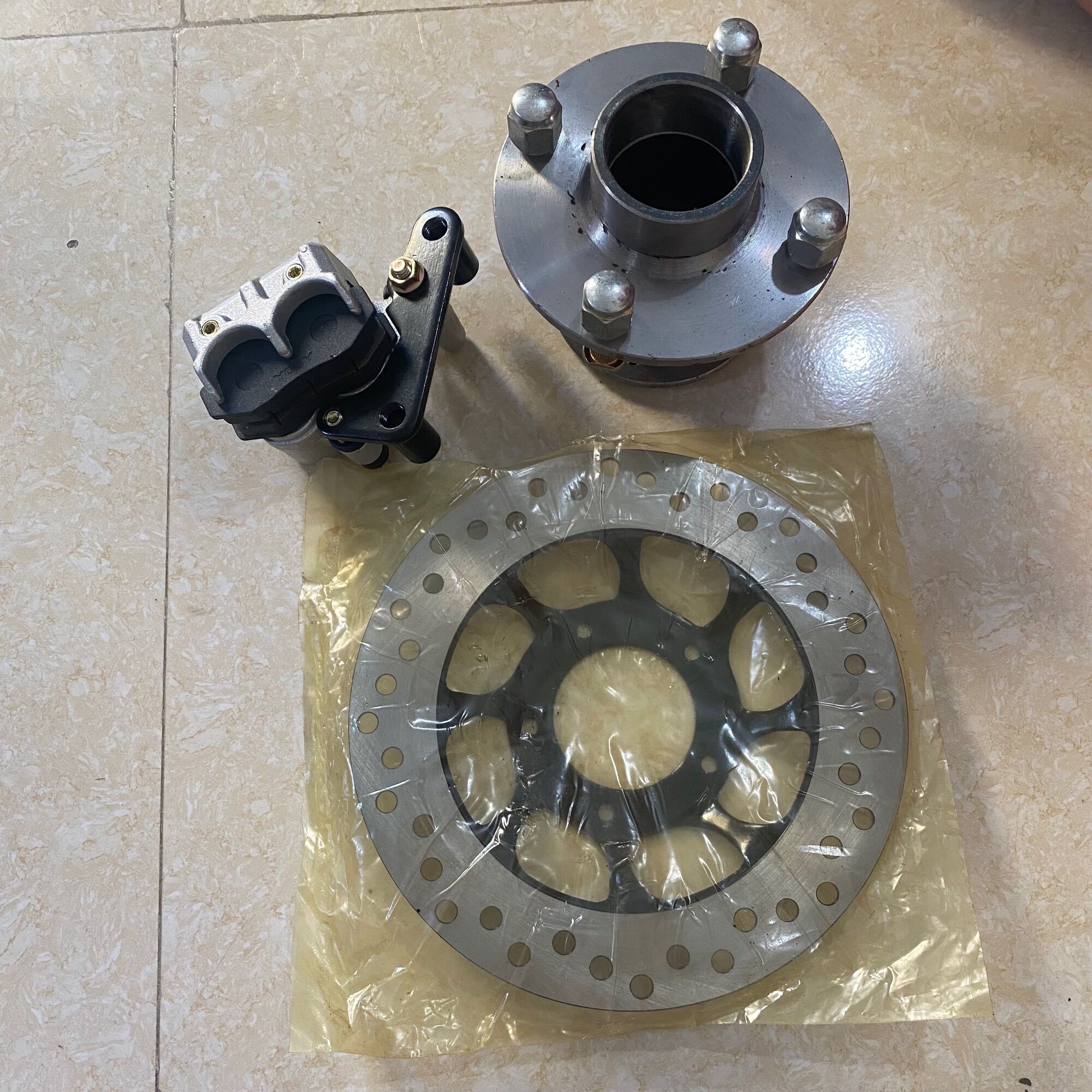 Bộ may ơ trước phanh đĩa xe ba gác