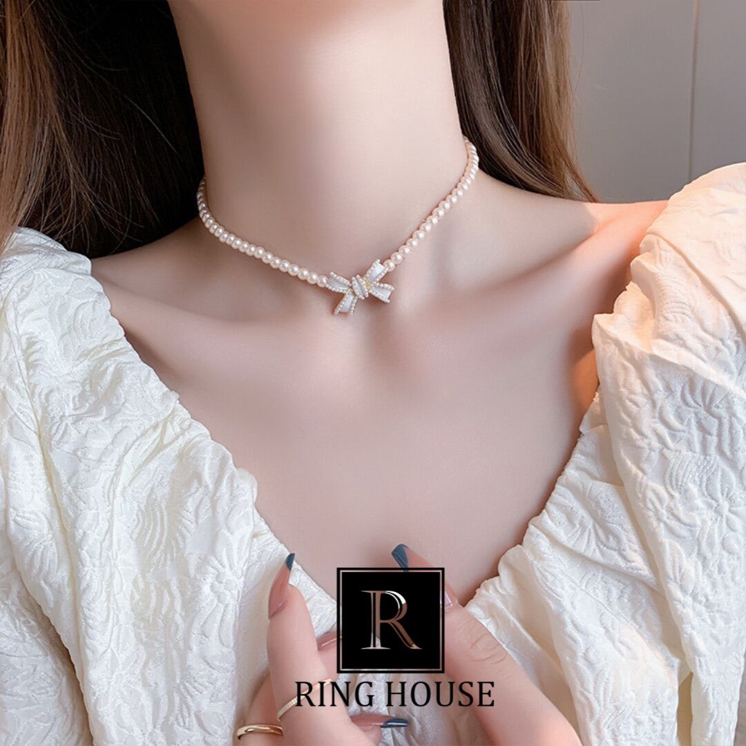 Dây chuyền choker vòng cổ hạt trai hồng phấn đính nơ xinh