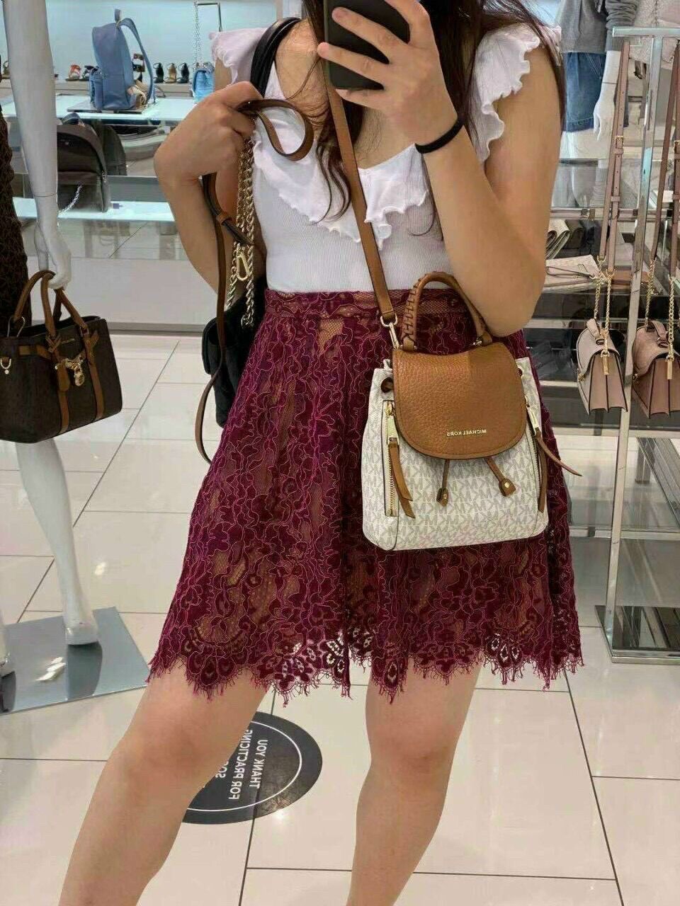 Balo MK mini dây rút 2 ngăn kéo phía trước