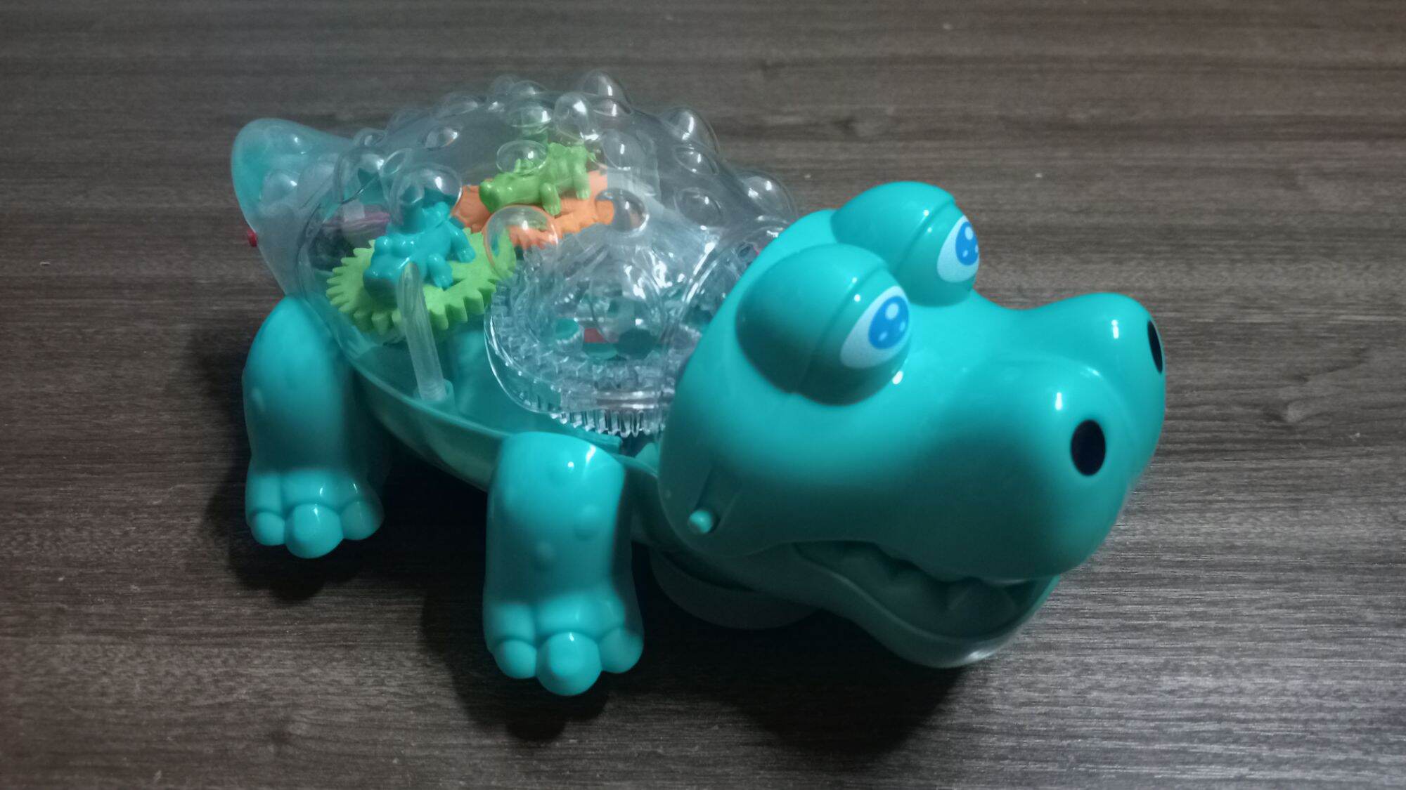 Đồ chơi con cá sấu bò có nhạc và đèn cho bé