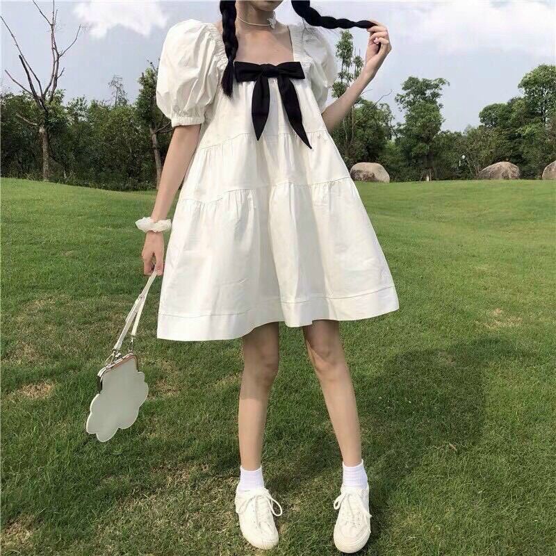 Đầm babydoll trắng nơ đen siêu đáng yêu