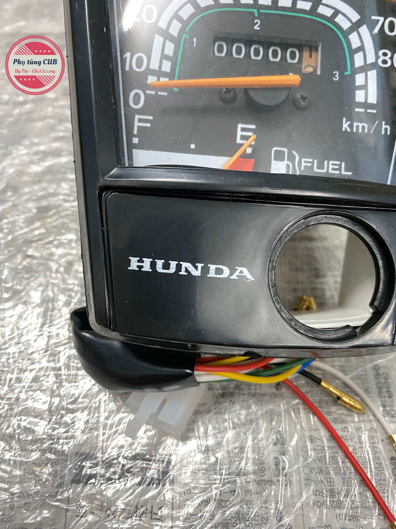 Đồng hồ xe cub DD70 mặt chữ thường ( chức năng hoạt động tốt)