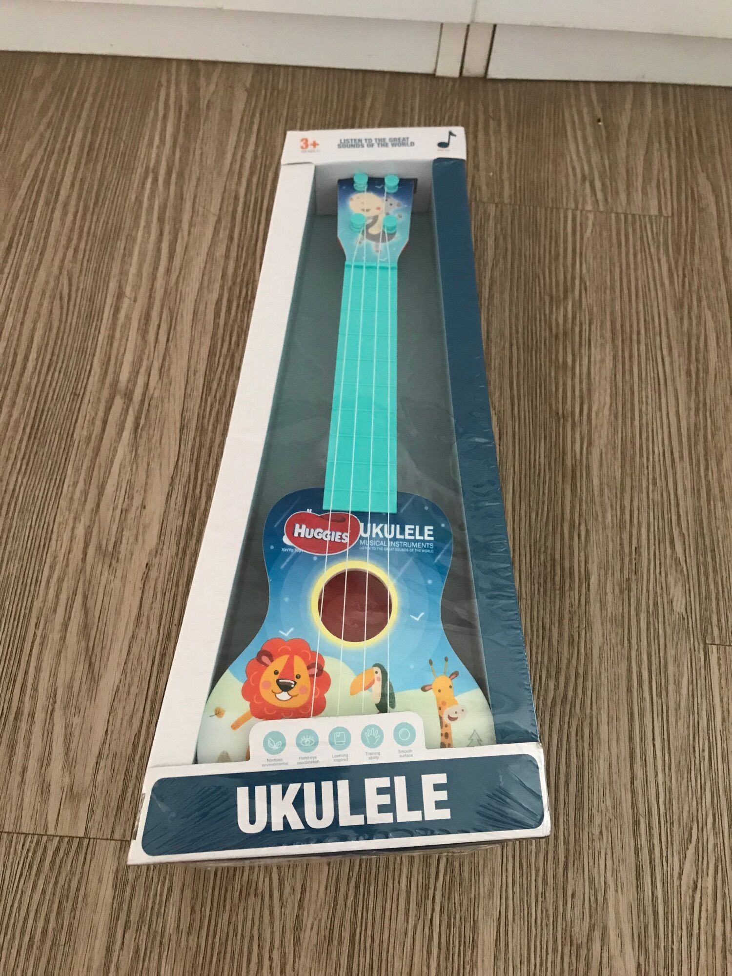 Đàn ukulele mini cho bé quà tặng huggies