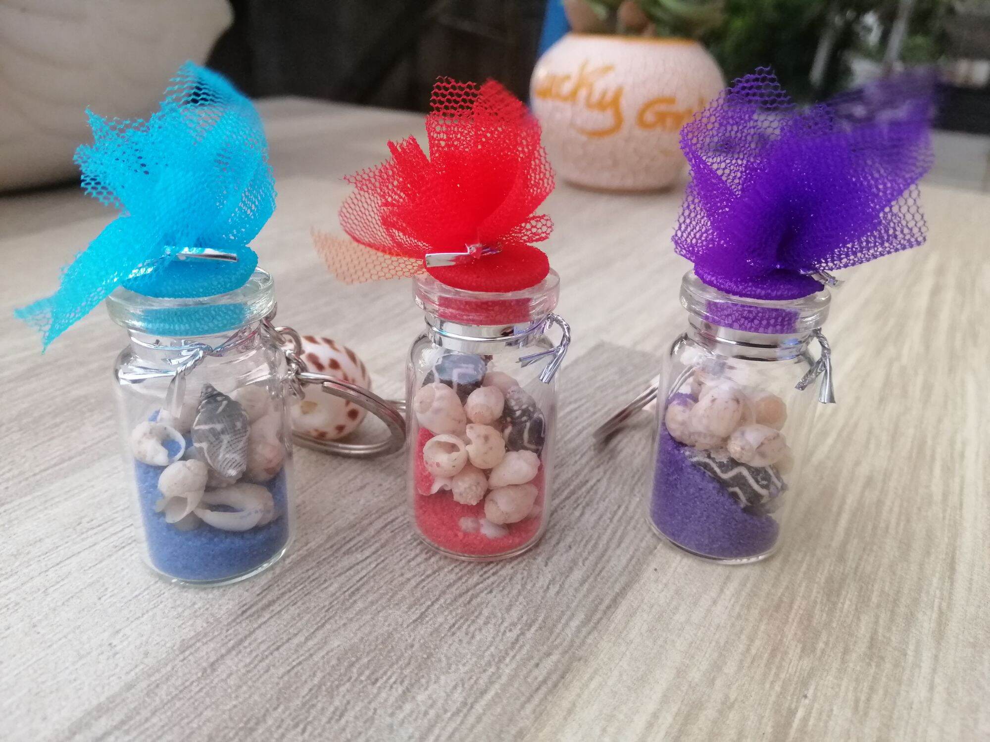 MÓC KHÓA CHAI THỦY TINH ĐỰNG ỐC SIZE 2*4 CM
