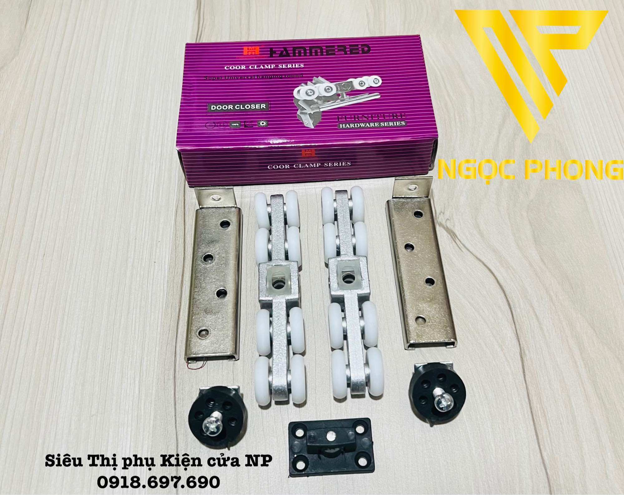 Bộ bánh xe treo cửa lùa nhôm - sắt -gỗ hộp tím