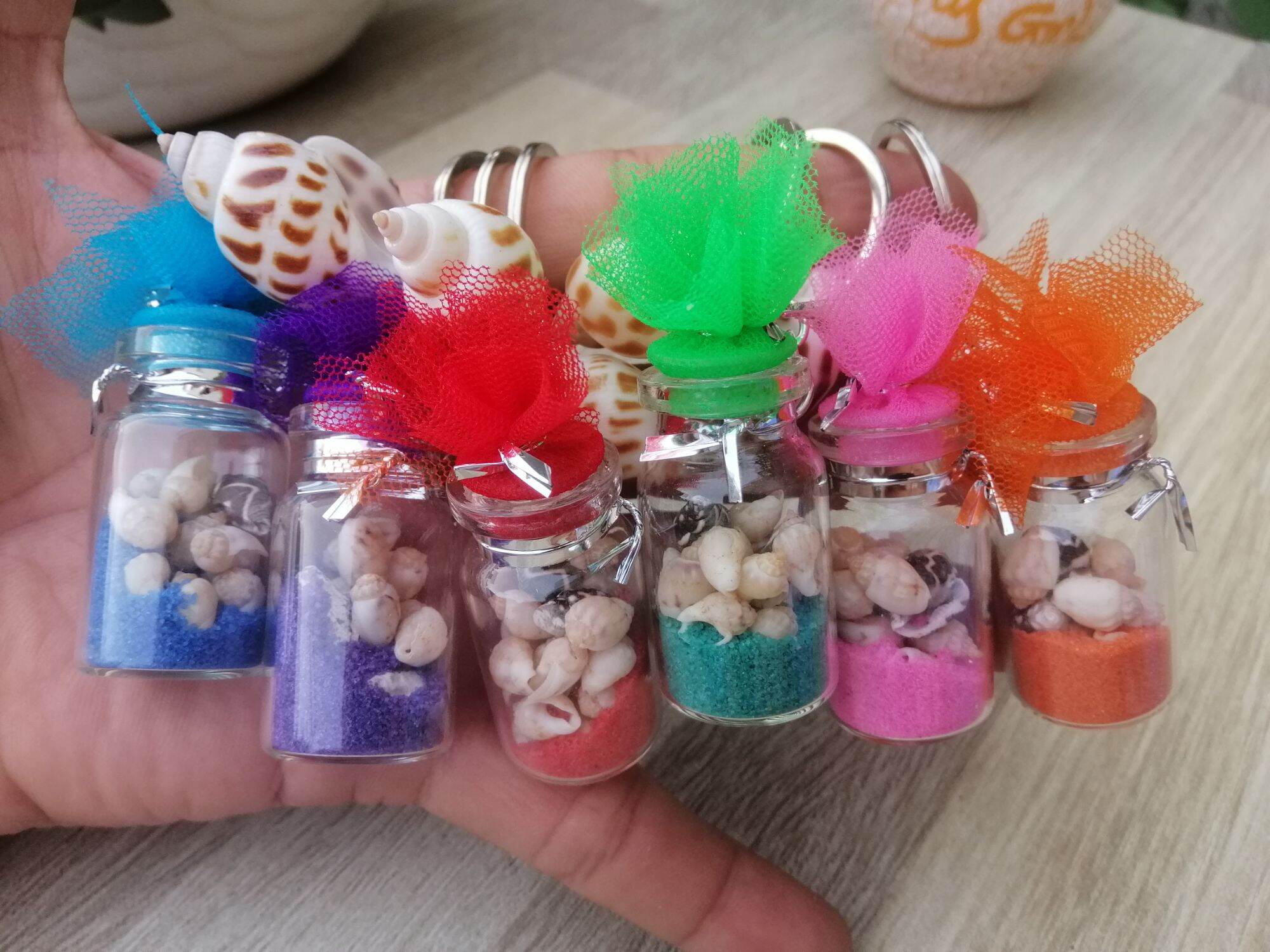 MÓC KHÓA CHAI THỦY TINH ĐỰNG ỐC SIZE 2*4 CM