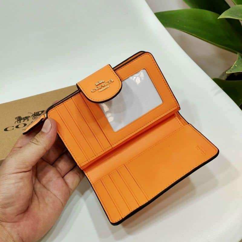 Ví C0ach cầm tay họa tiết hoa siêu đẹp