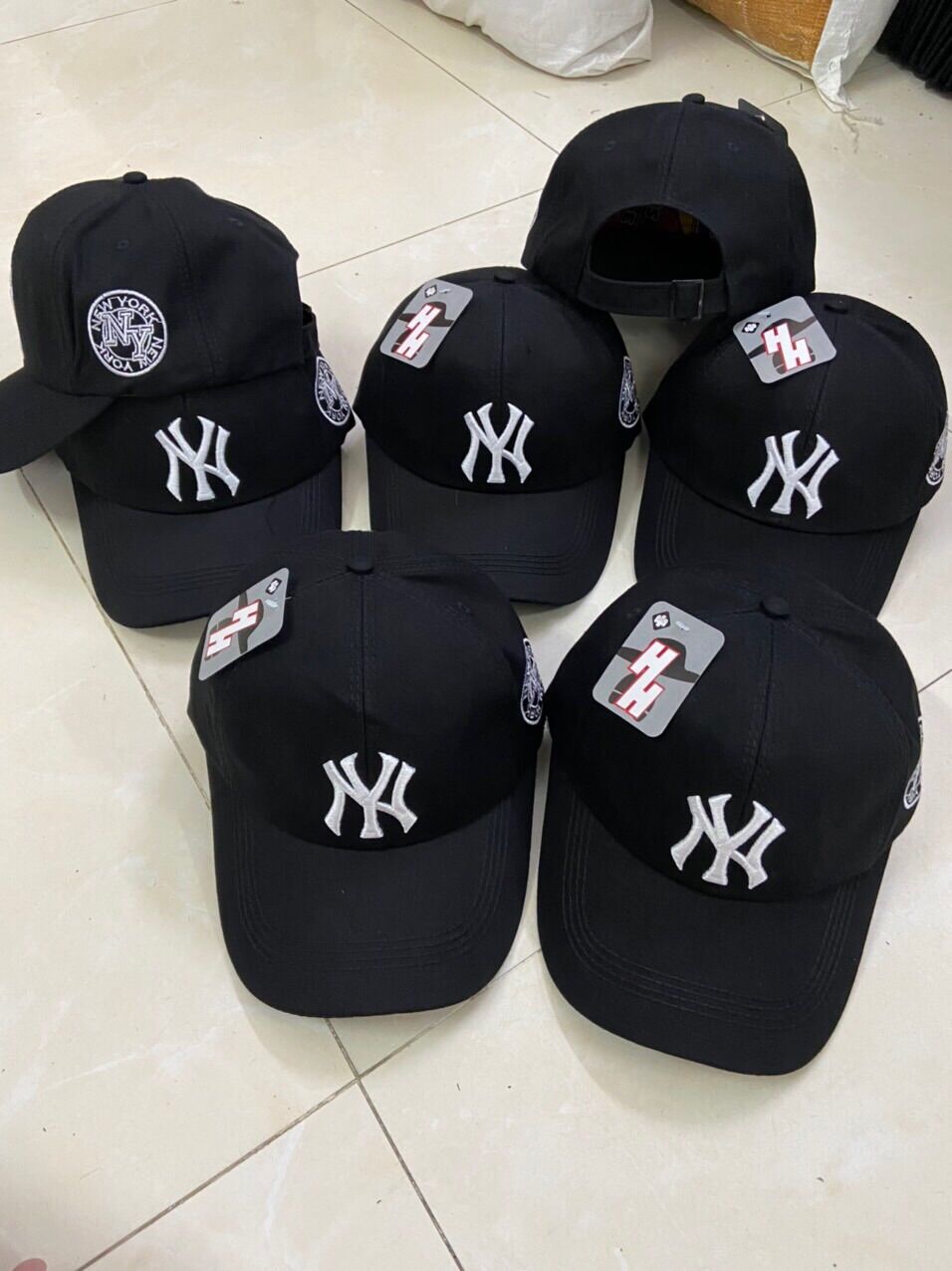 Nón kết kaki đen thêu nhiều logo