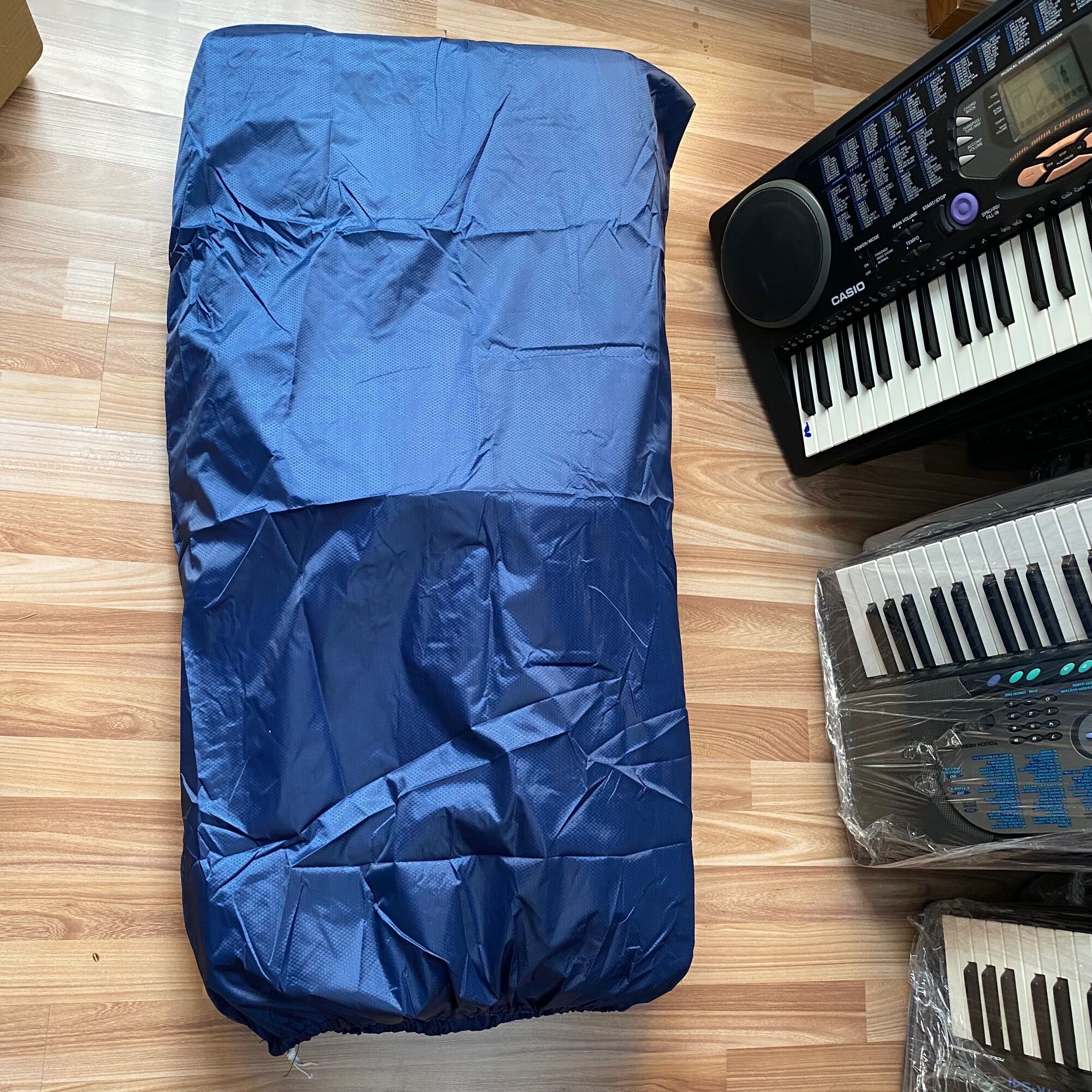 Bao áo mưa cho đàn organ .