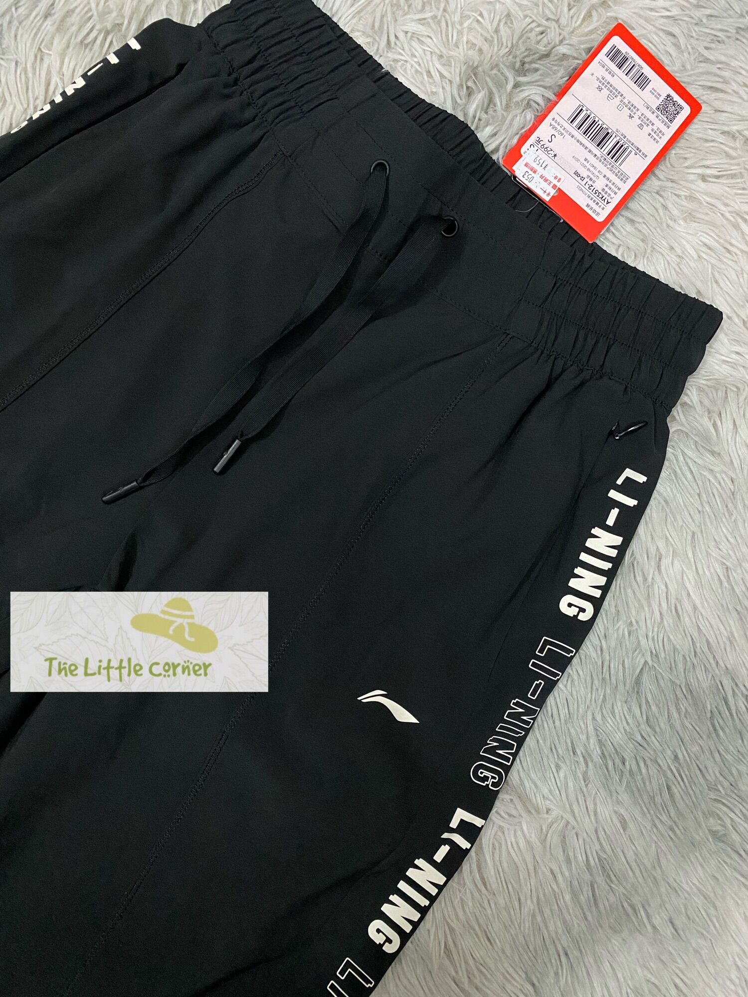 Quần gió thể thao nữ Lining AYKS512-1