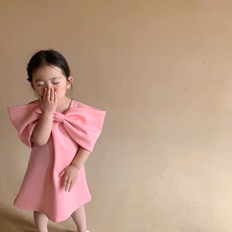 Váy hồng nơ bản to cho bé gái