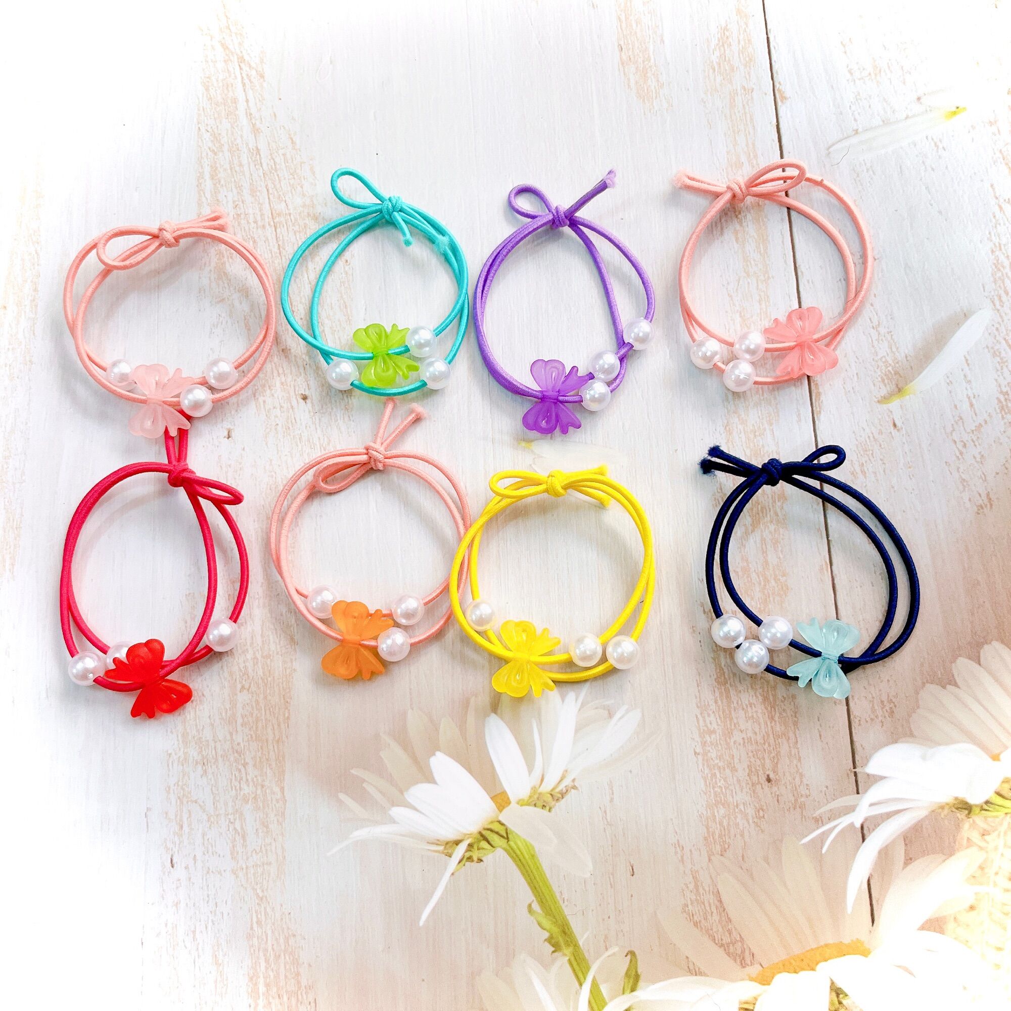 Set 100 dây cột tóc nơ ngọc 3 hạt trai giá rẻ