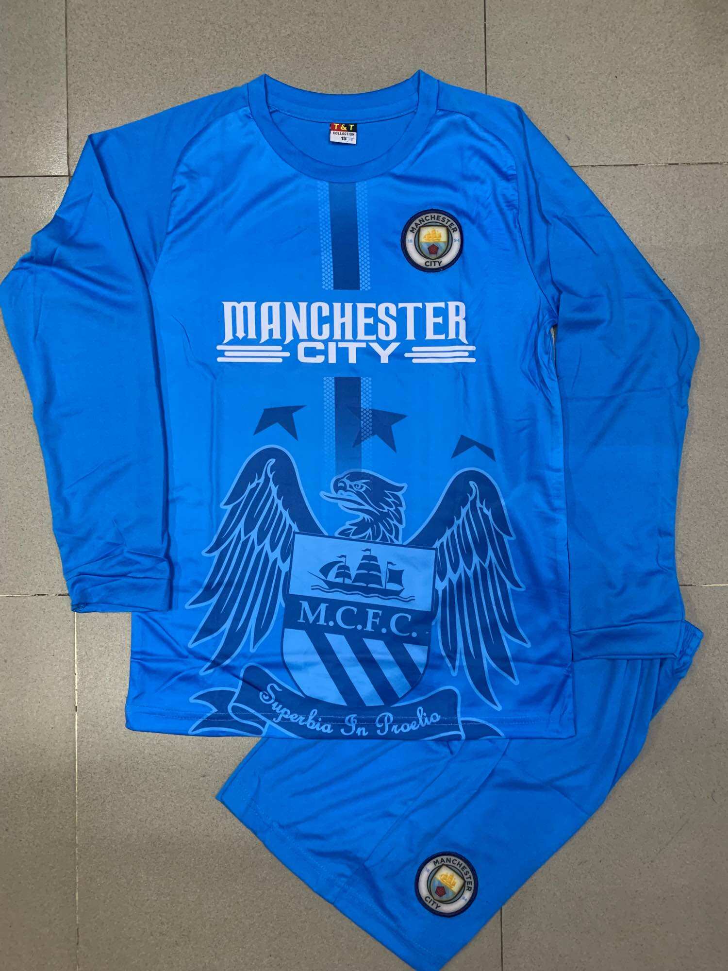 Đồ đá banh tay dài Manchester mới size 9-15