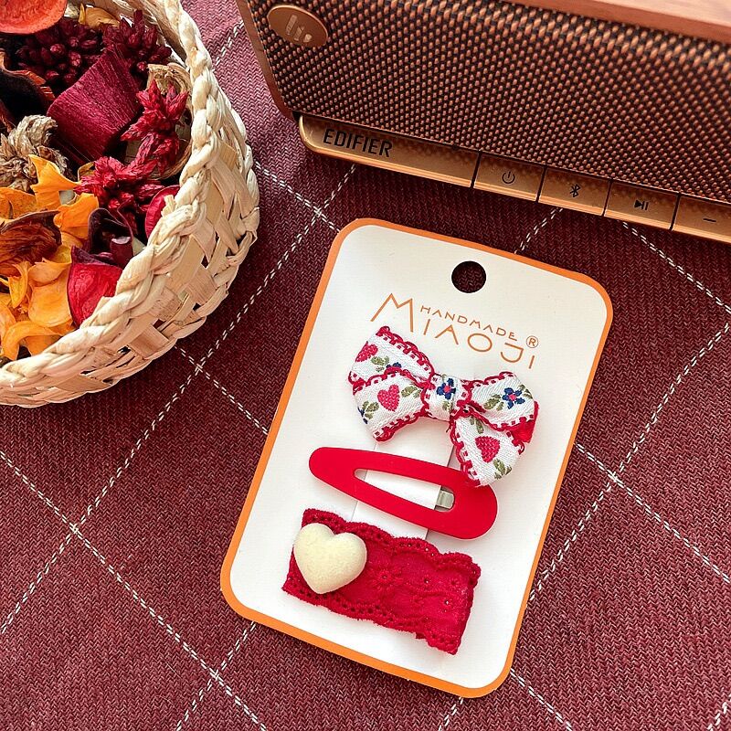 Set kẹp tóc màu đỏ lễ Tết cho bé gái