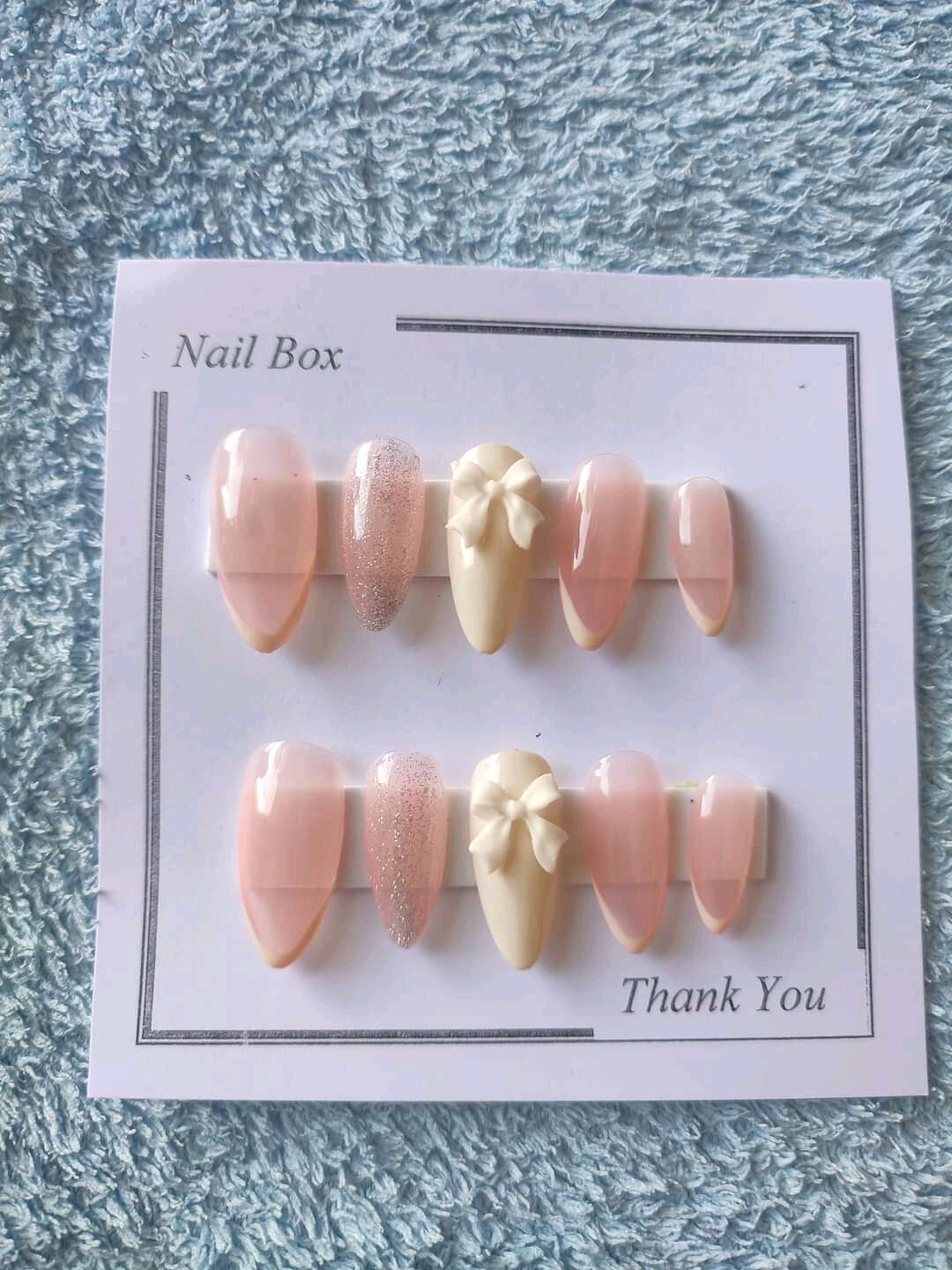 Móng tay giả thiết kế Huyền Trang Nail màu hồng thạch đính nơ