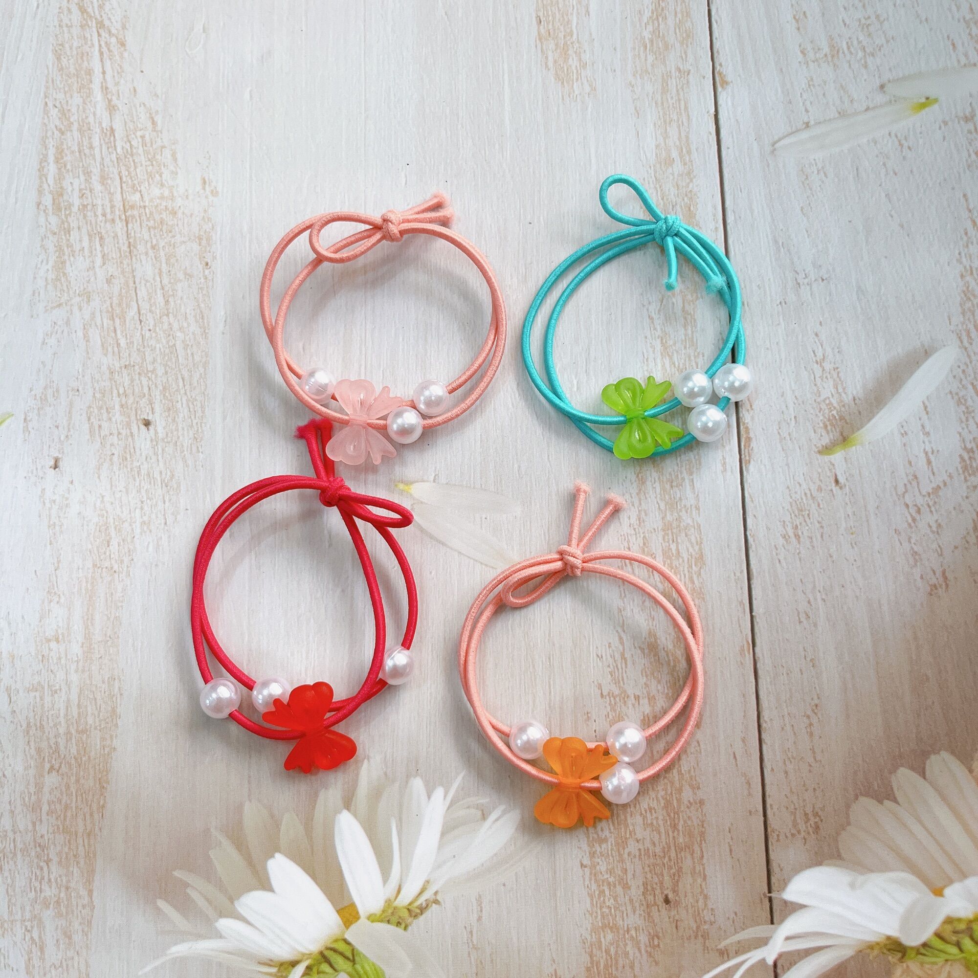 Set 100 dây cột tóc nơ ngọc 3 hạt trai giá rẻ