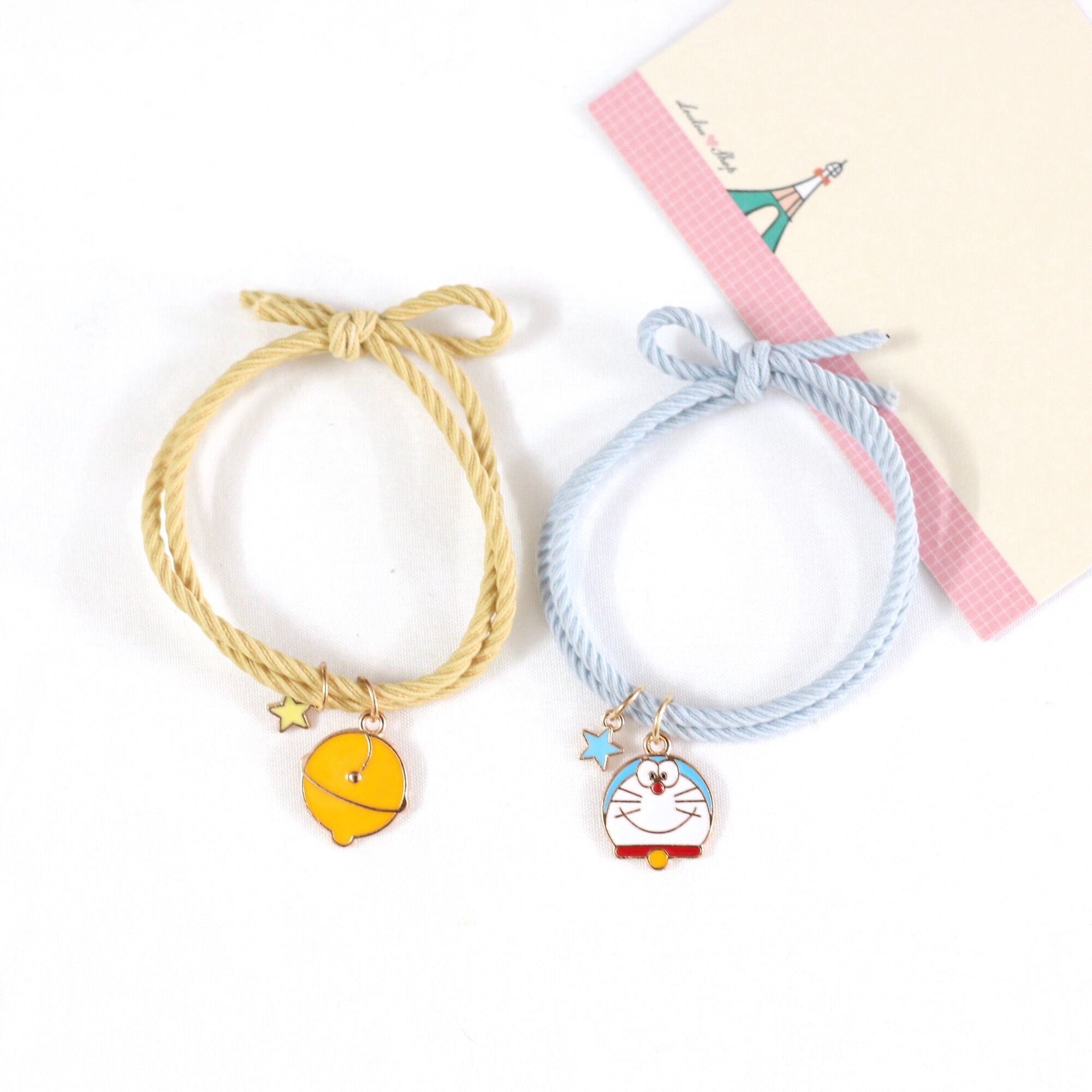 Combo 2 Dây Thun Buộc Tóc Mon + Chuông/Vòng Tay Doremon Doraemon