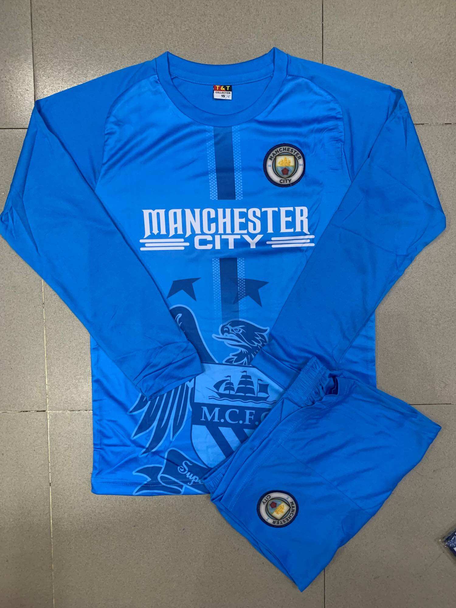 Đồ đá banh tay dài Manchester mới size 9-15