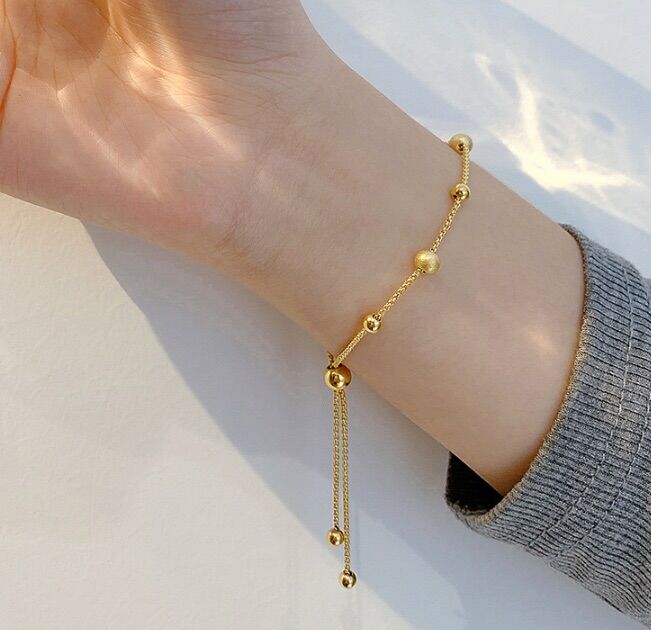 6599 - Lắc tay titan dây rút bi trơn mix bi nhám