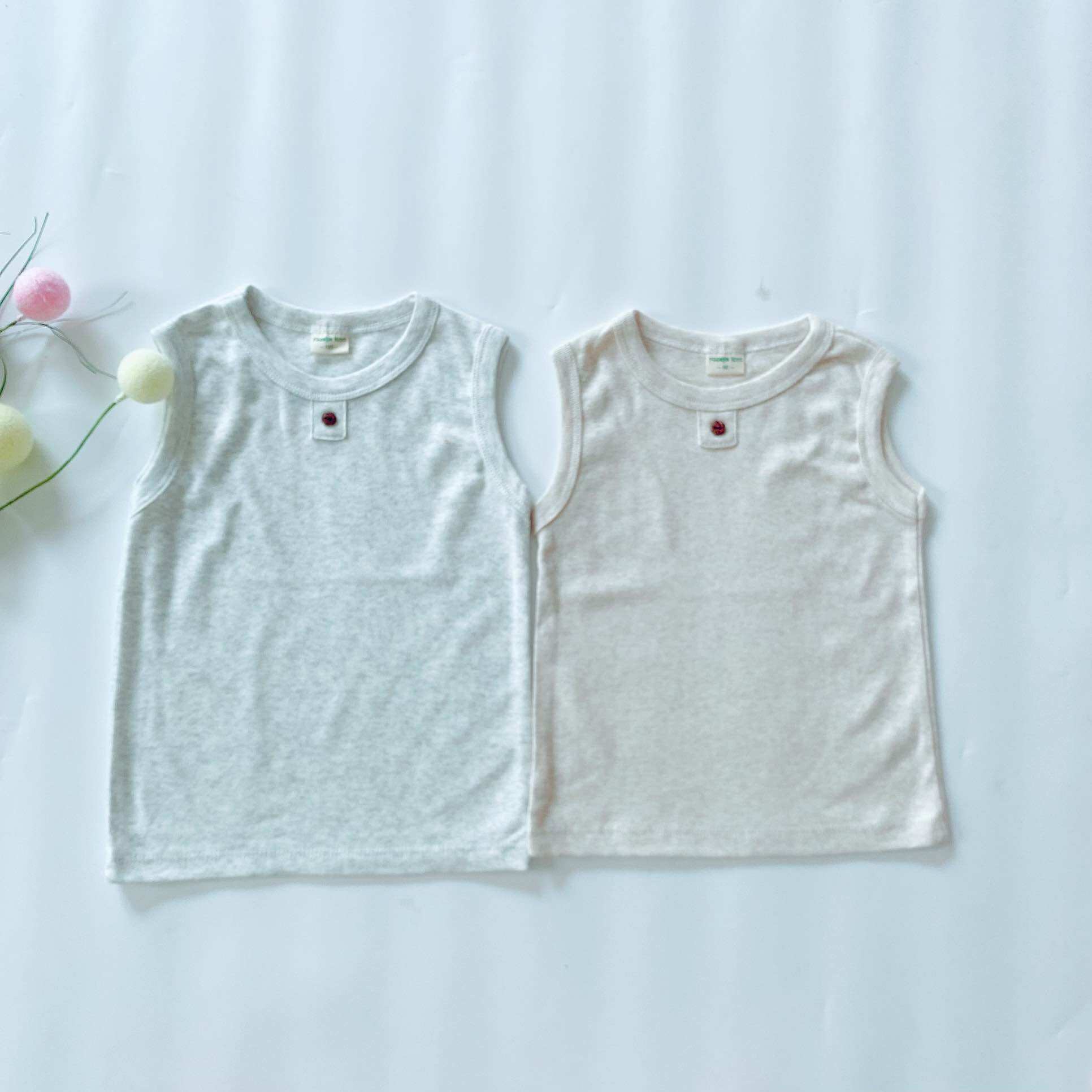 Áo ba lỗ bé trai bé gái phối nút chất cotton xuất dư