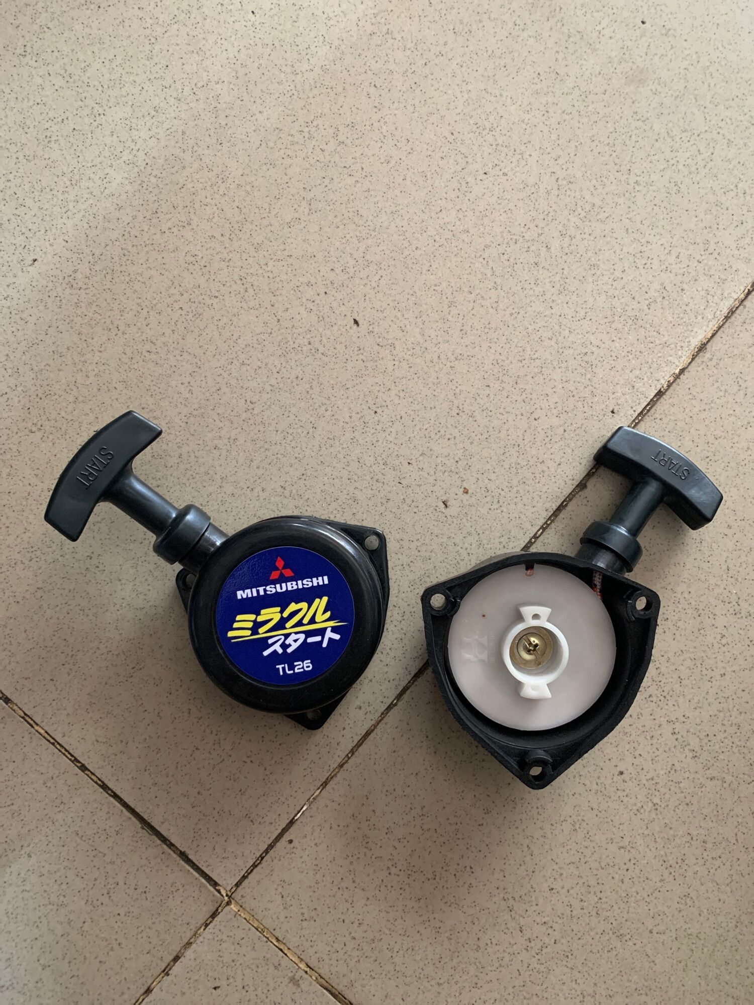 Chụp giật máy cắt cỏ Mitsubishi TL26