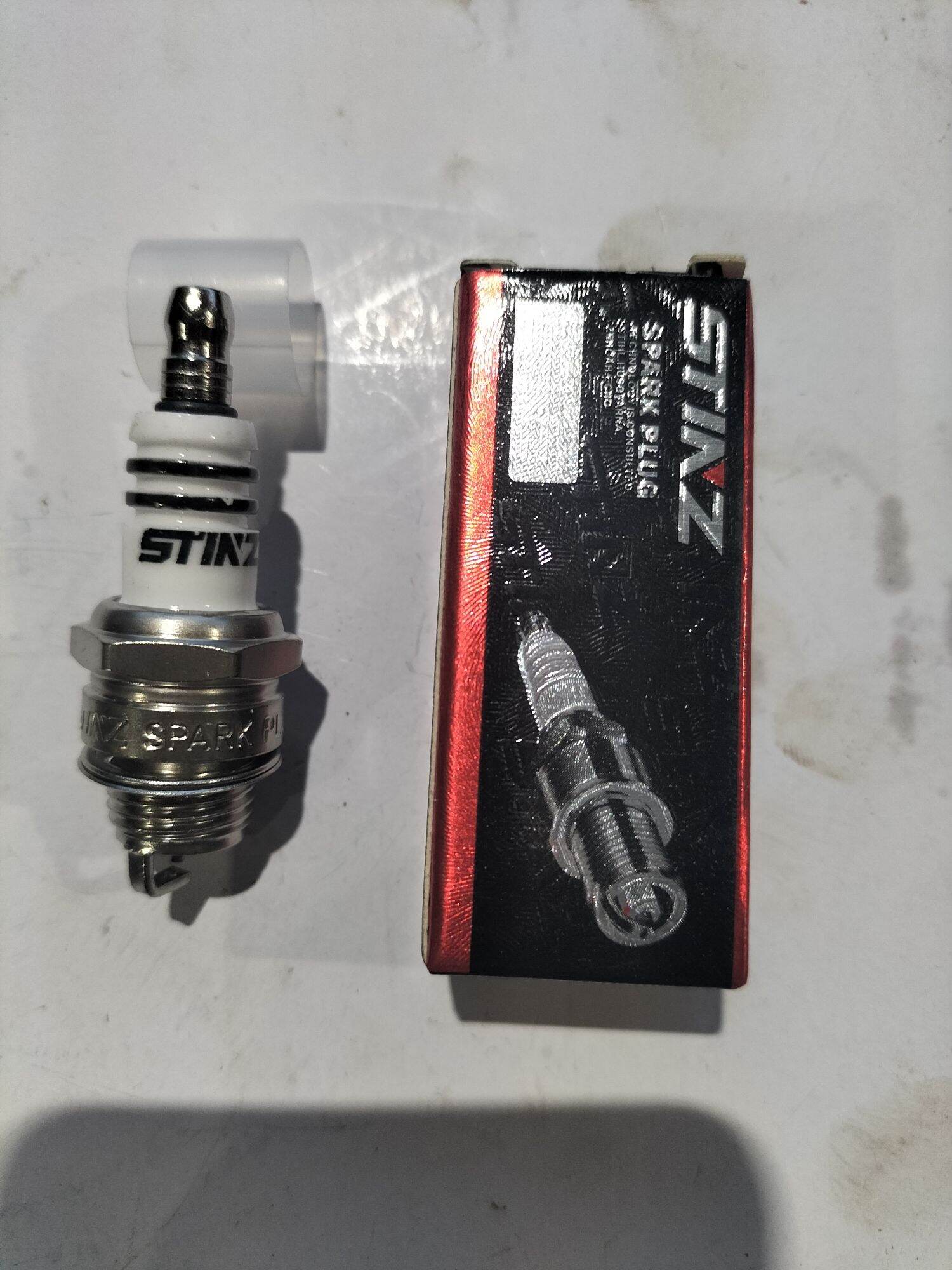 Bugi máy cắt cỏ máy cưa xích 2 thì