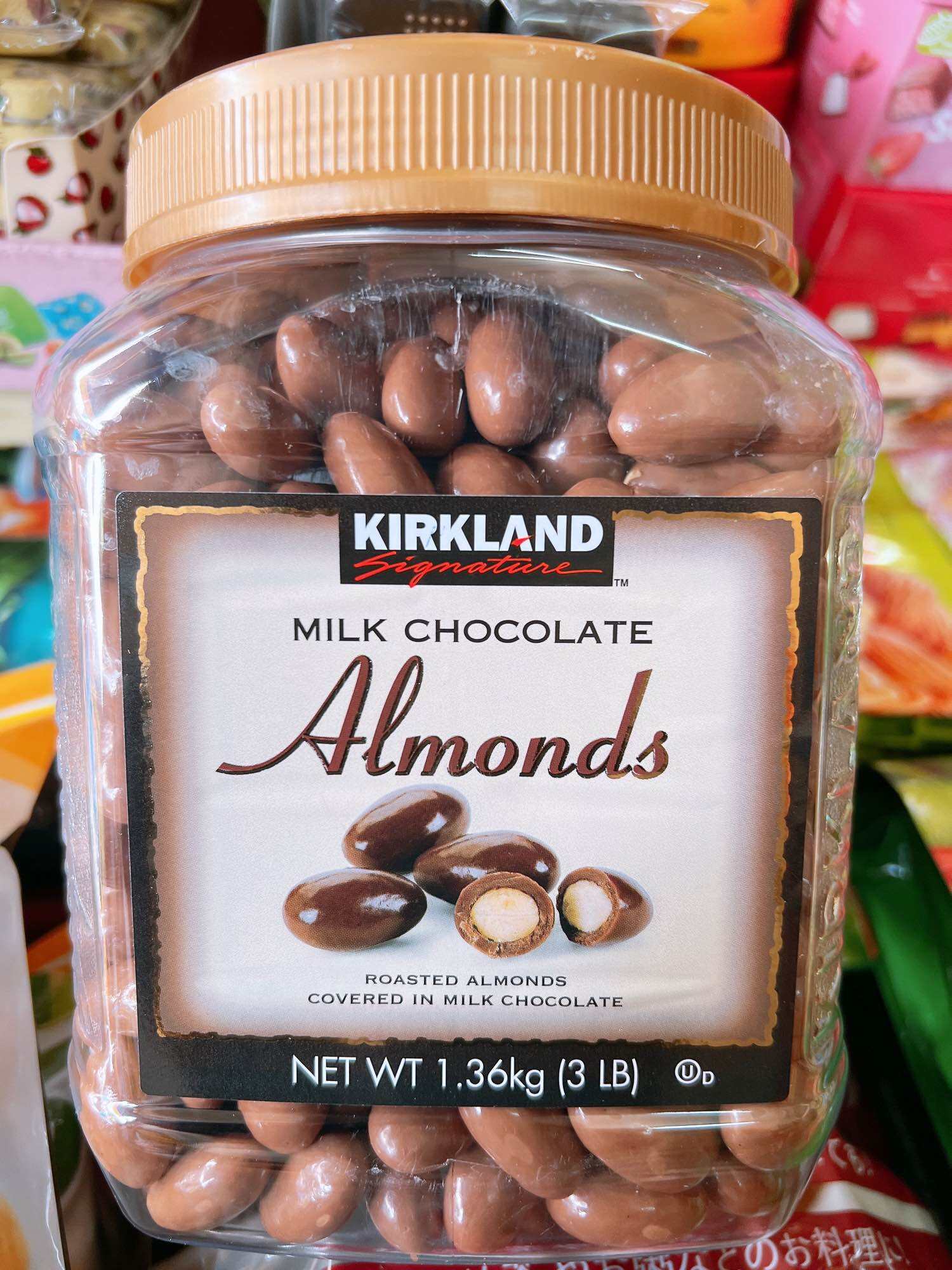 Date 7.2024  Socola bọc hạnh nhân Kirkland Signature Milk Chocolate