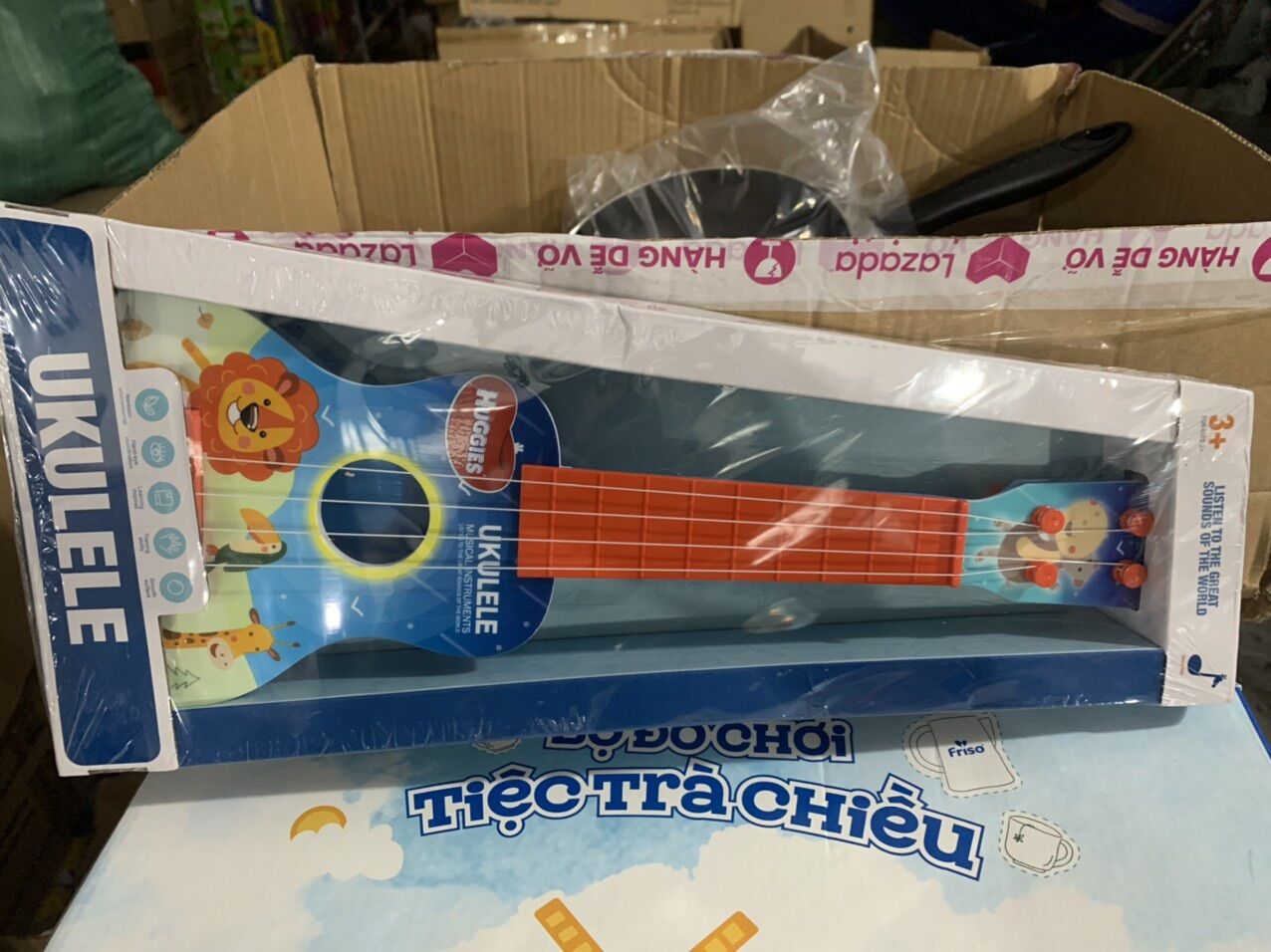 —- Đồ chơi đàn Ukulele- hkm tã