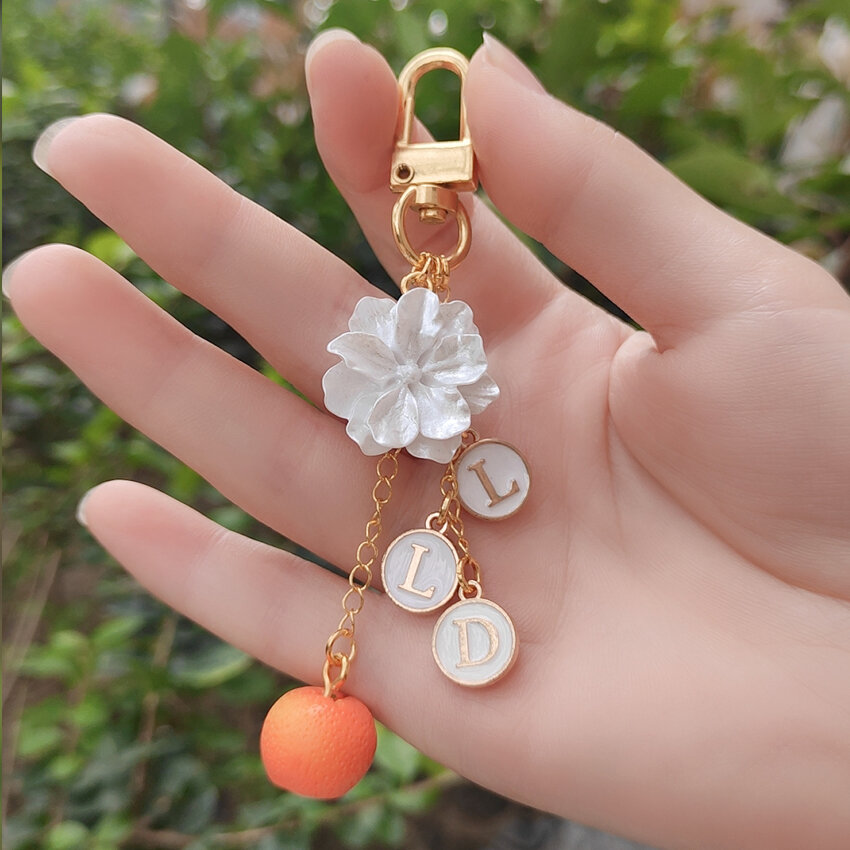 Phụ kiện treo móc chìa khóa móc treo chữ cái hoa dành dành dành cho hoa quả tiếp ứng bà xã cam quýt bao quanh maomao túi đáng yêu dây đeo điện thoại di động