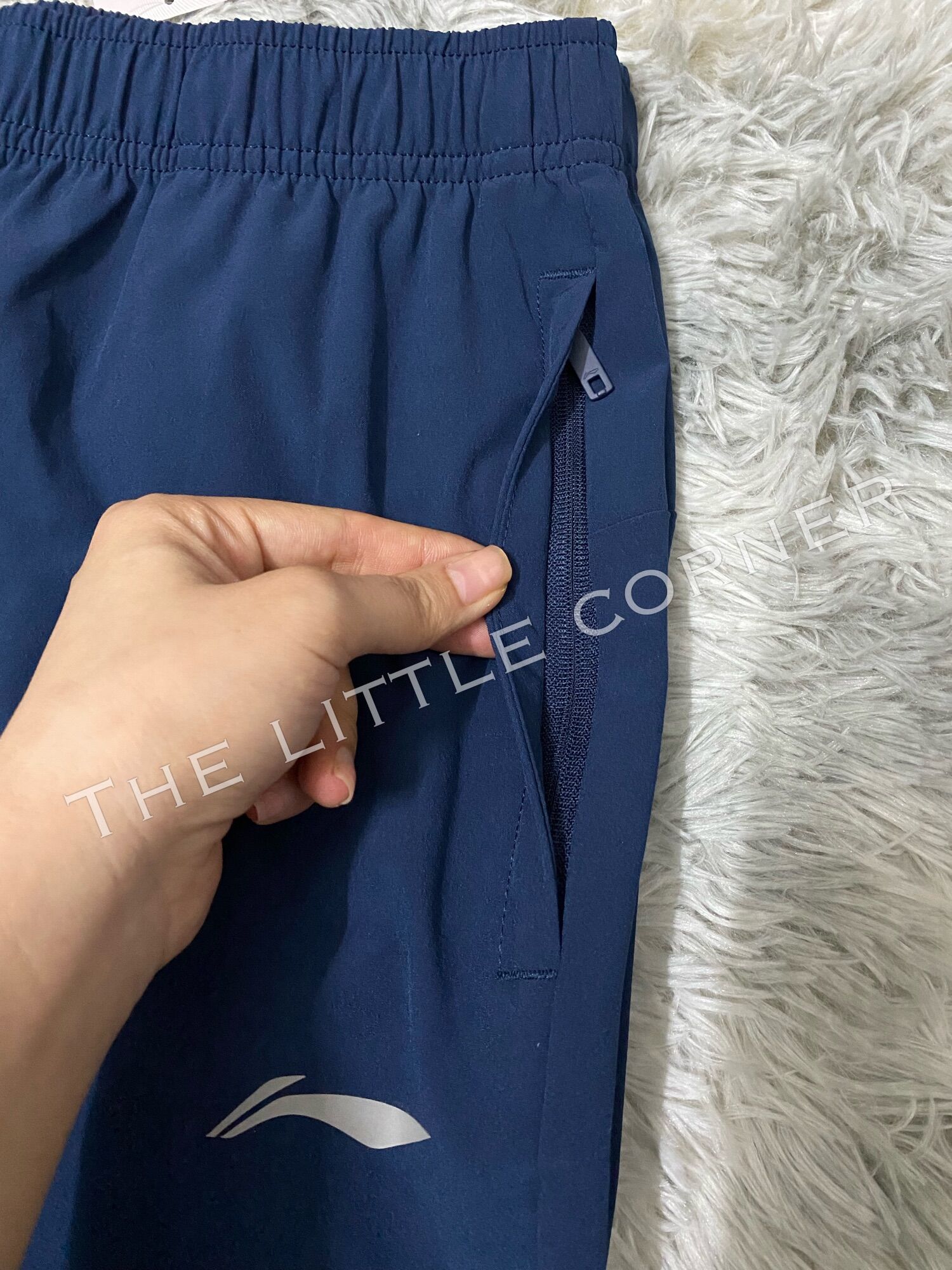 Quần gió nam Lining AYKR859