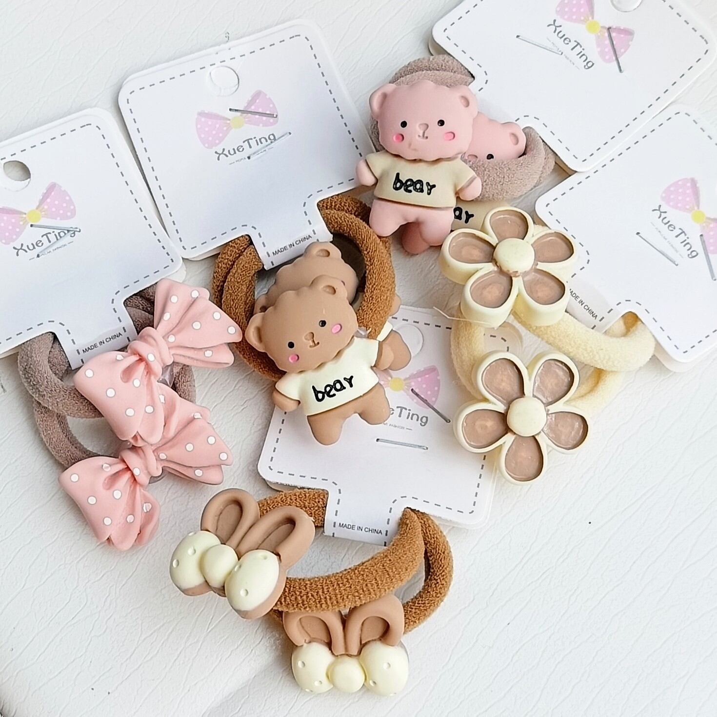 Sét 2 dây thun cột tóc đính charme hoạ tiết dễ thương cho bé
