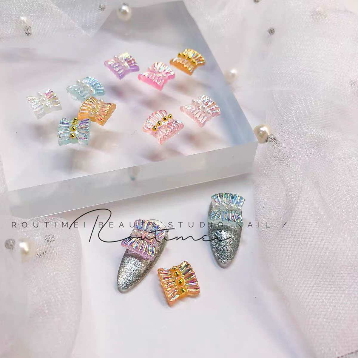 Sale charm nơ nhúng tone màu ngtrai cực xinh