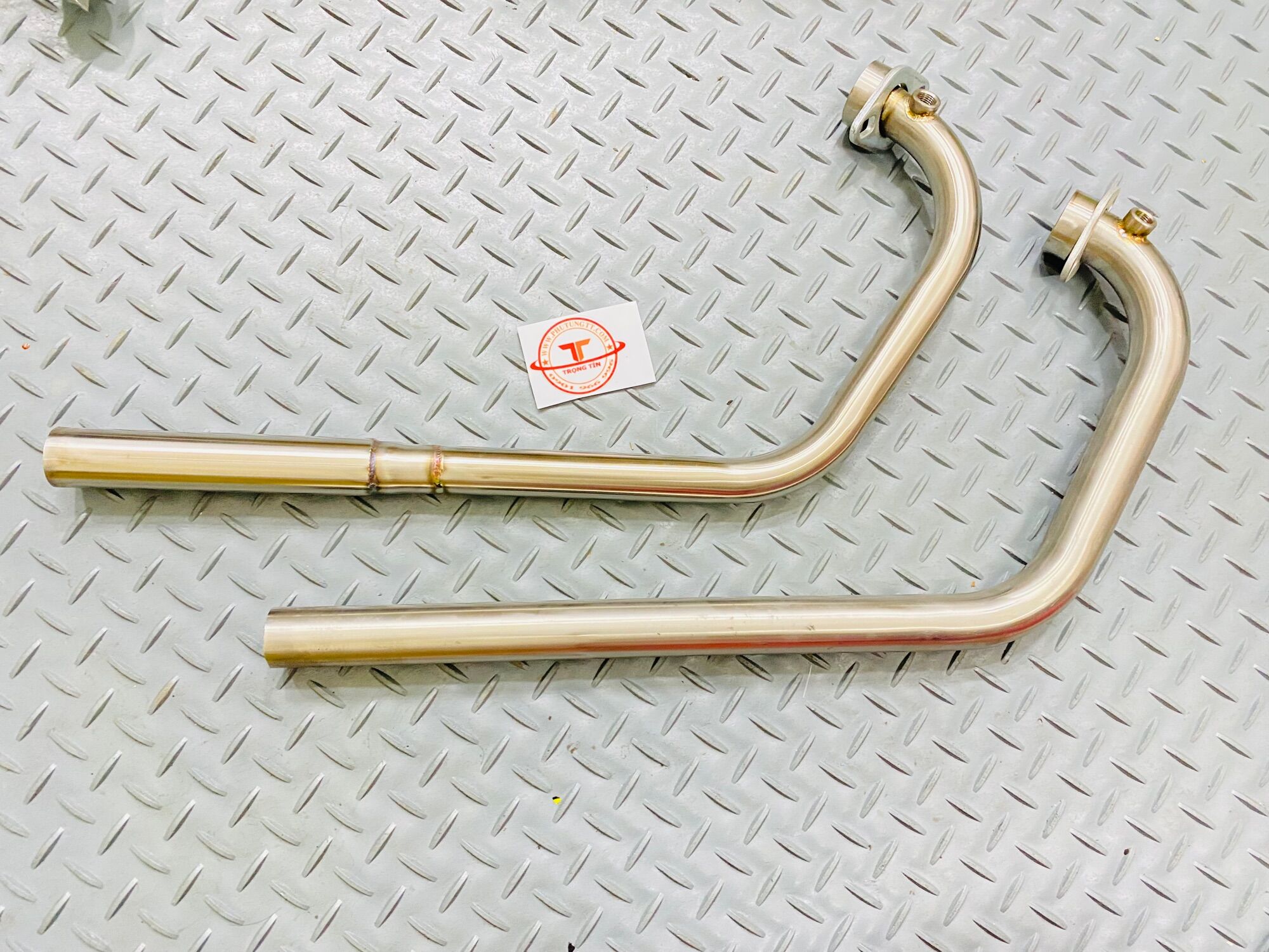 Cổ pô gắn pô zin Suzuki Raider Satria uốn CNC