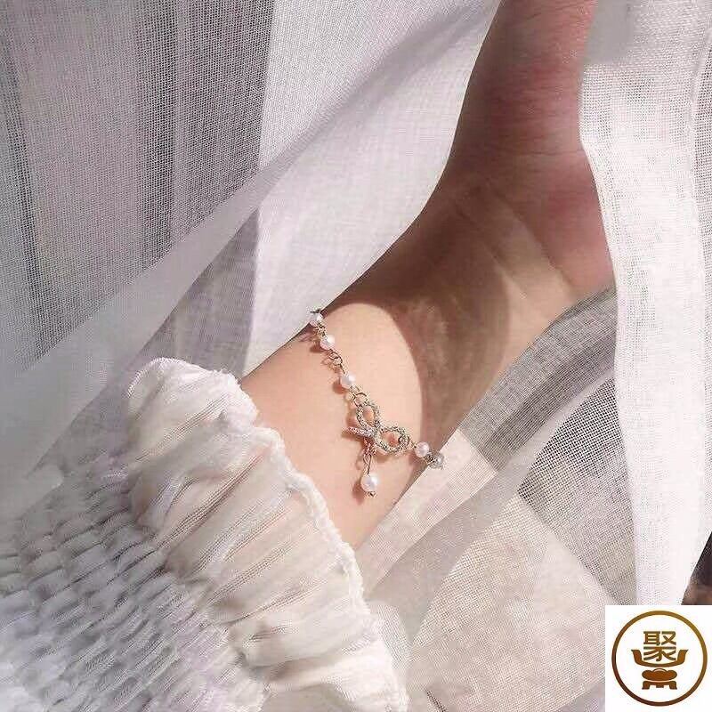 Vòng tay chuỗi ngọc đính nơ tiểu thư