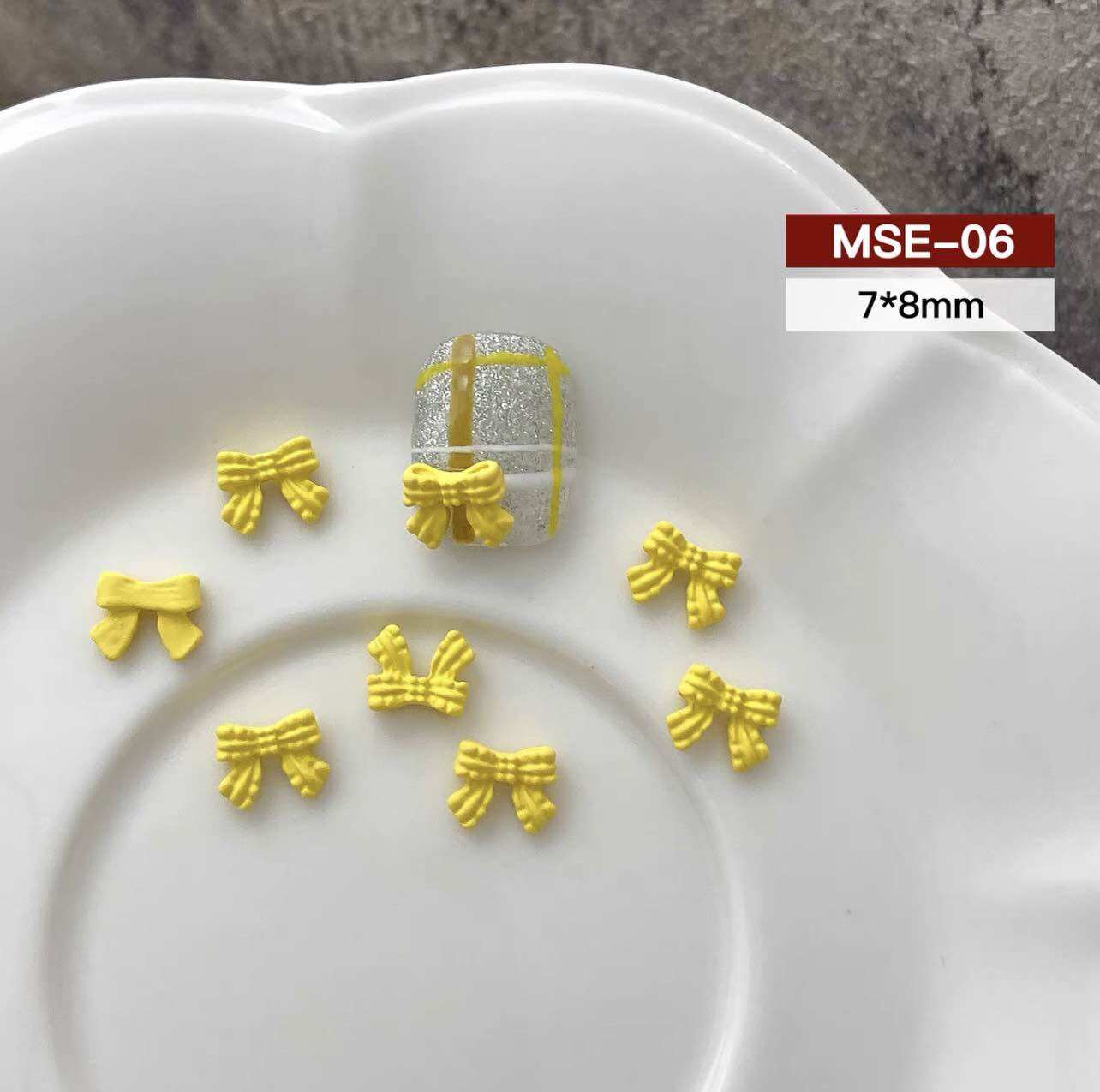 CHARM NƠ VÀNG SET 15 VIÊN M703