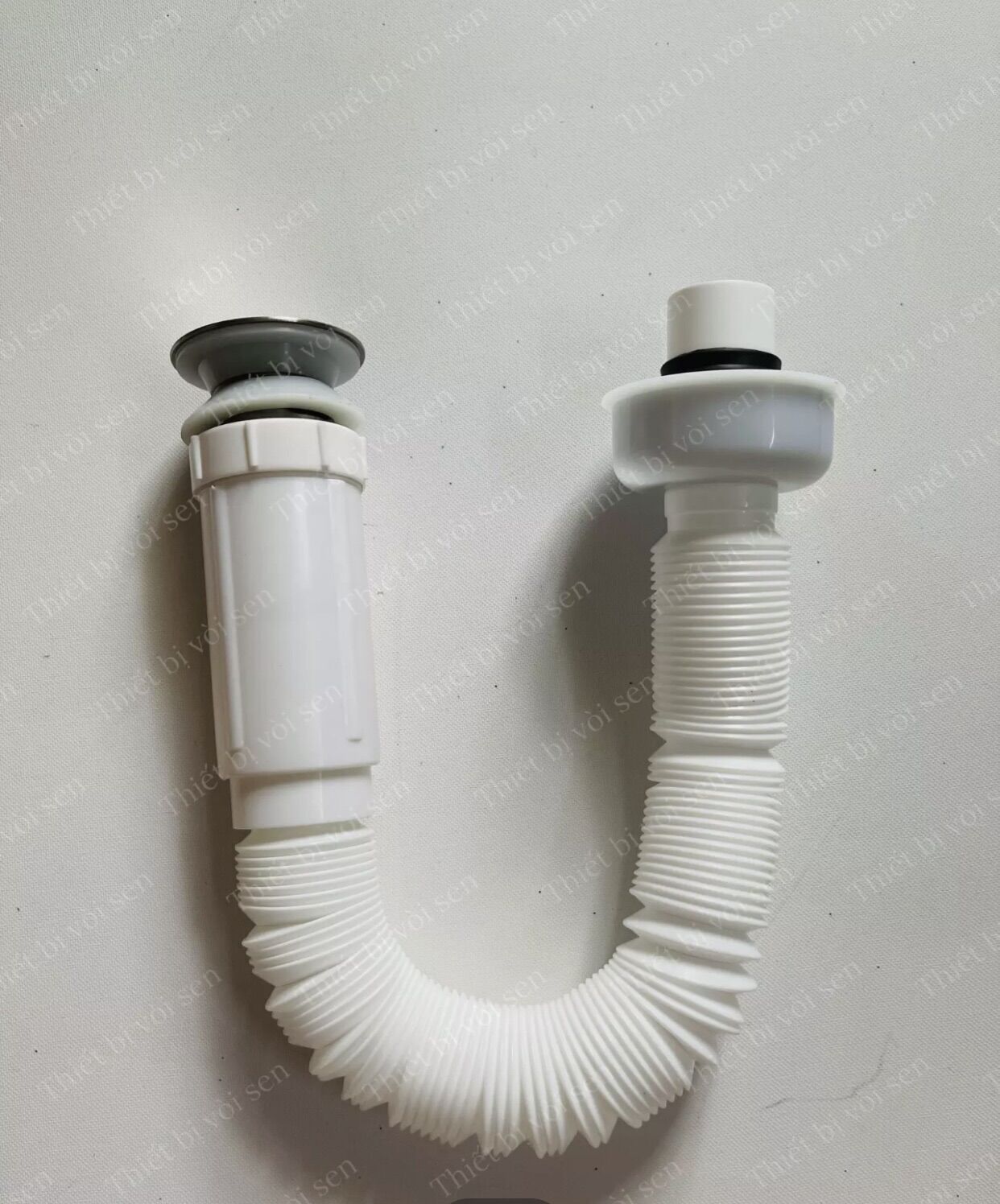 Ống xả ruột gà, xi phông ruột gà( loại đầu nhấn)chống hôi, dùng cho lavabo treo âm bàn, đặt bàn