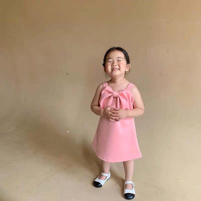 Váy hồng nơ bản to cho bé gái