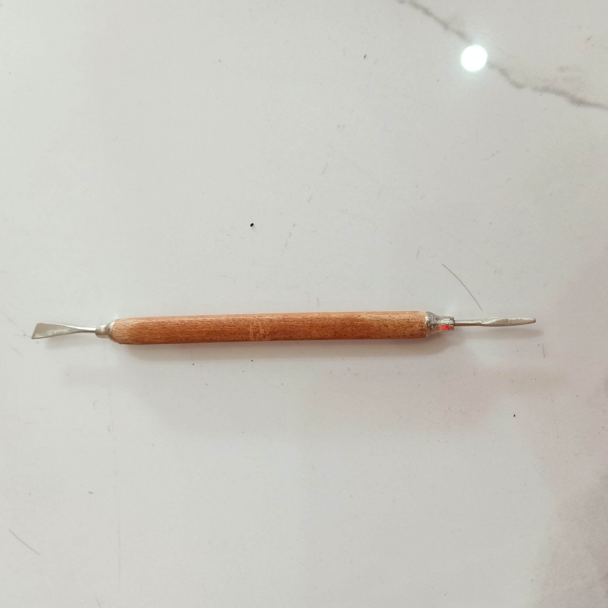 cây móc khoé gỗ 2 đầu