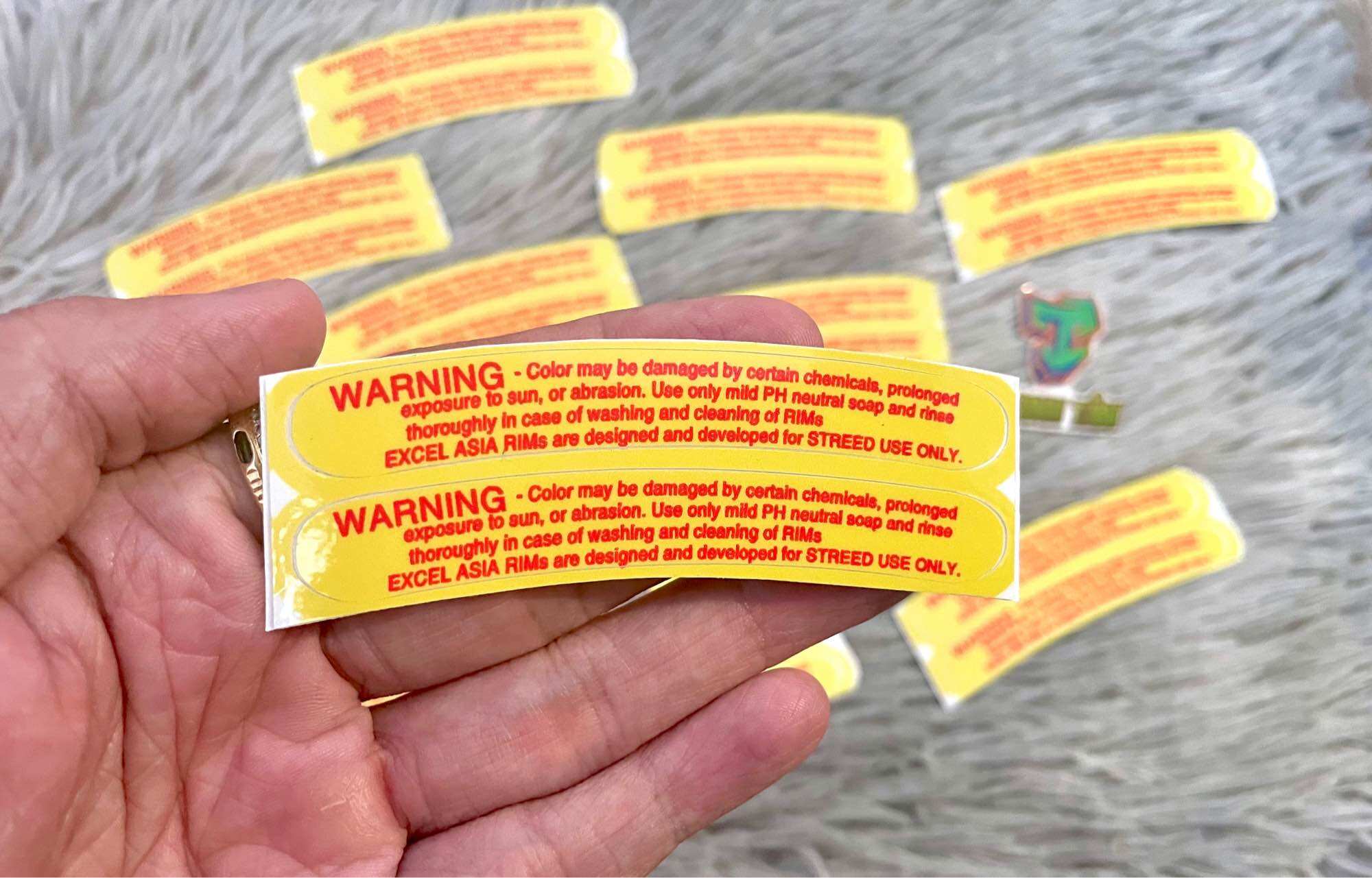 Bộ 2 tem Warning dán vành xe máy.