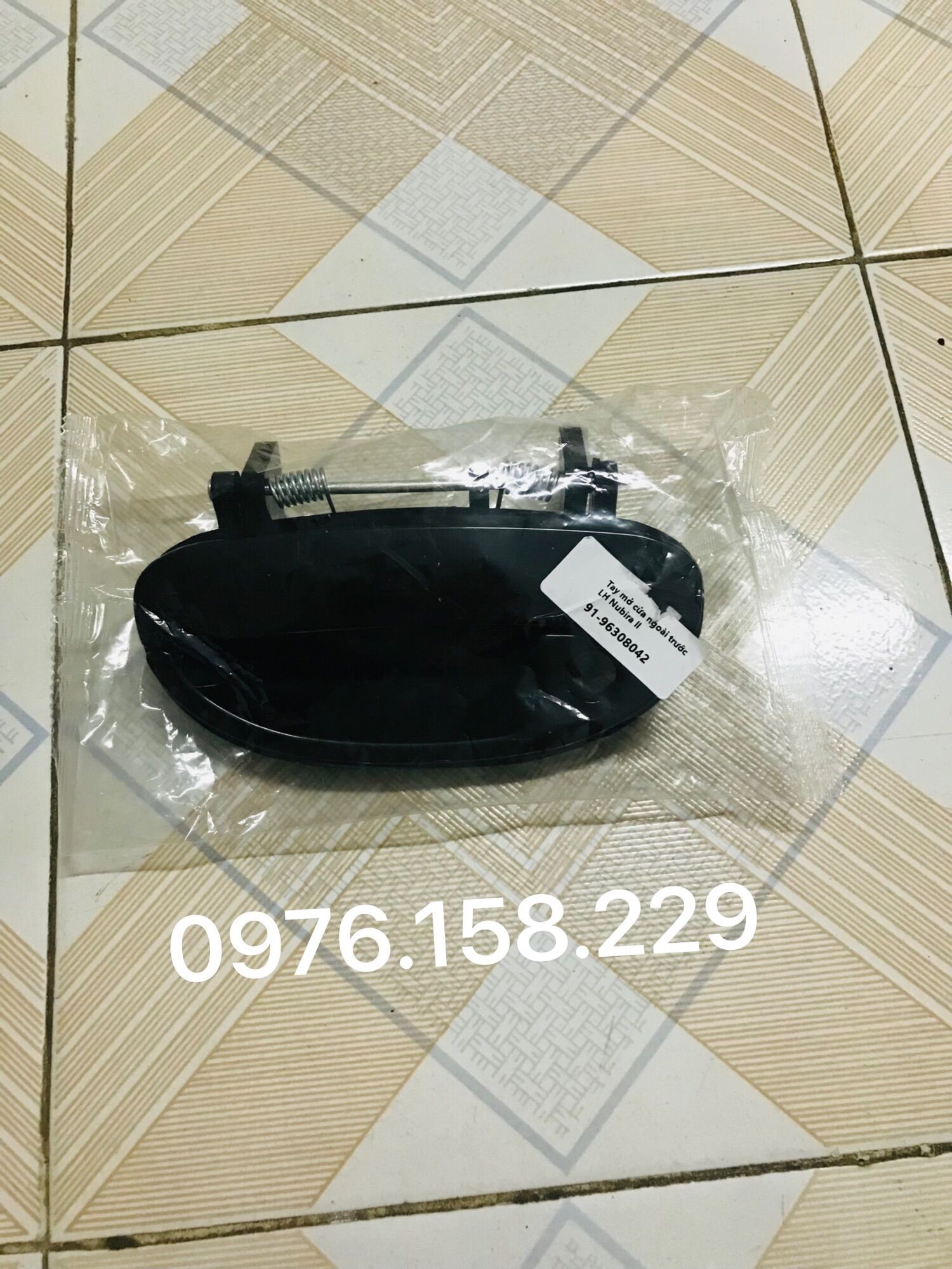 Tay mở cửa ngoài daewoo nubira